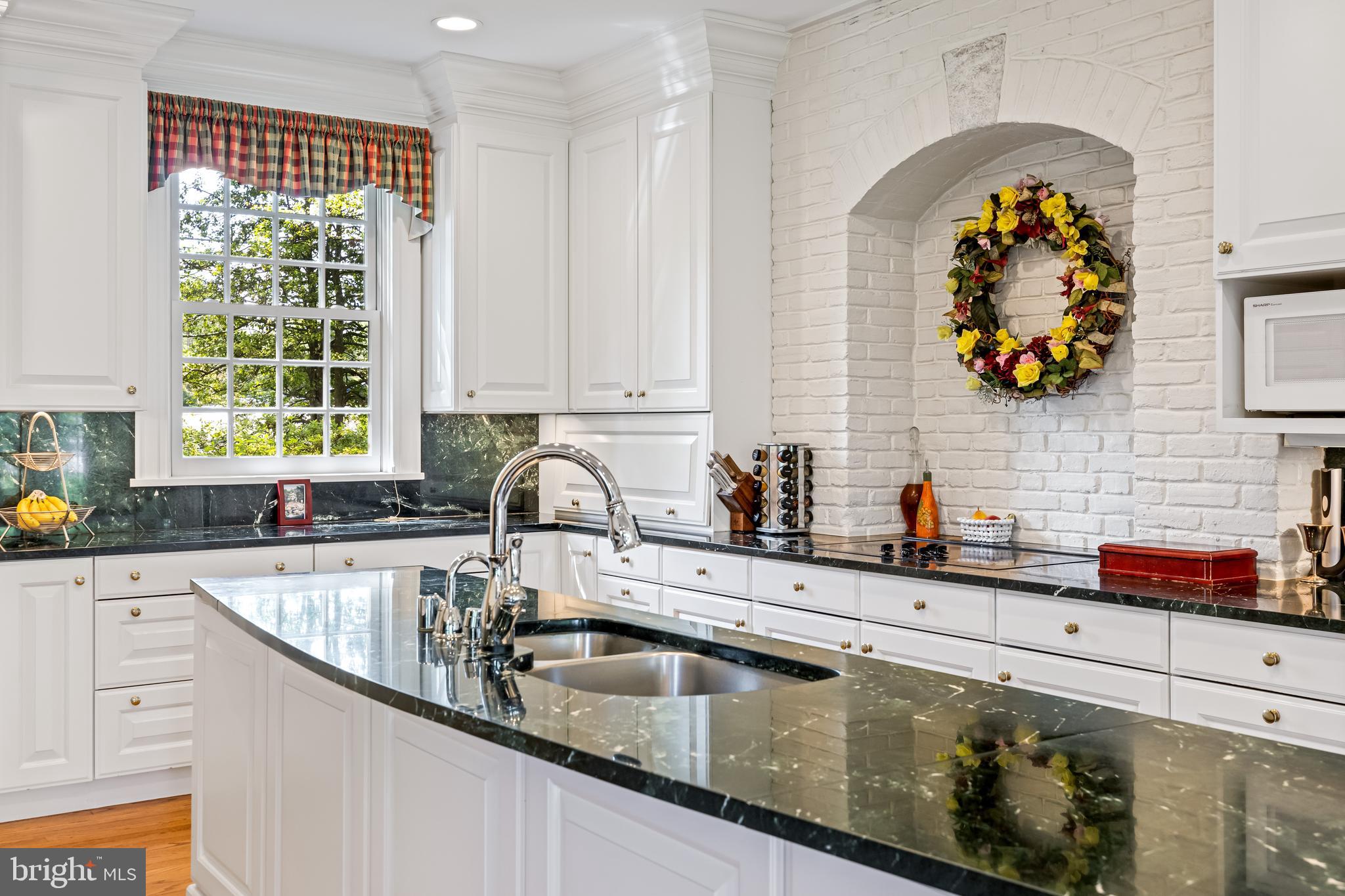 508 Hampton Lane Baltimore, MD 21286 - Photo 20 of 74 a kitchen with granite countertop a sink and a stove