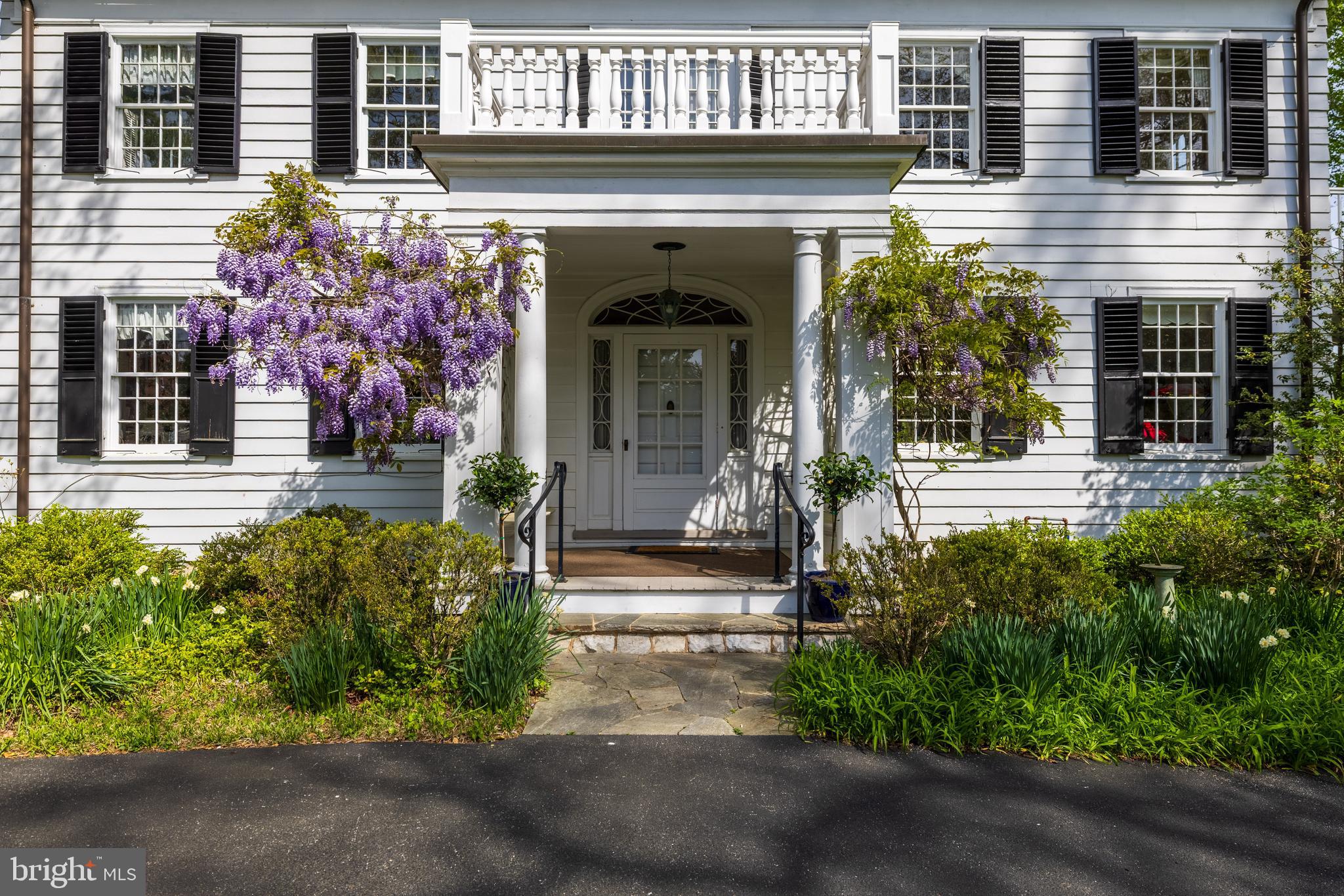 508 Hampton Lane Baltimore, MD 21286 - Photo 2 of 74 a view of a house with potted plants and a fountain