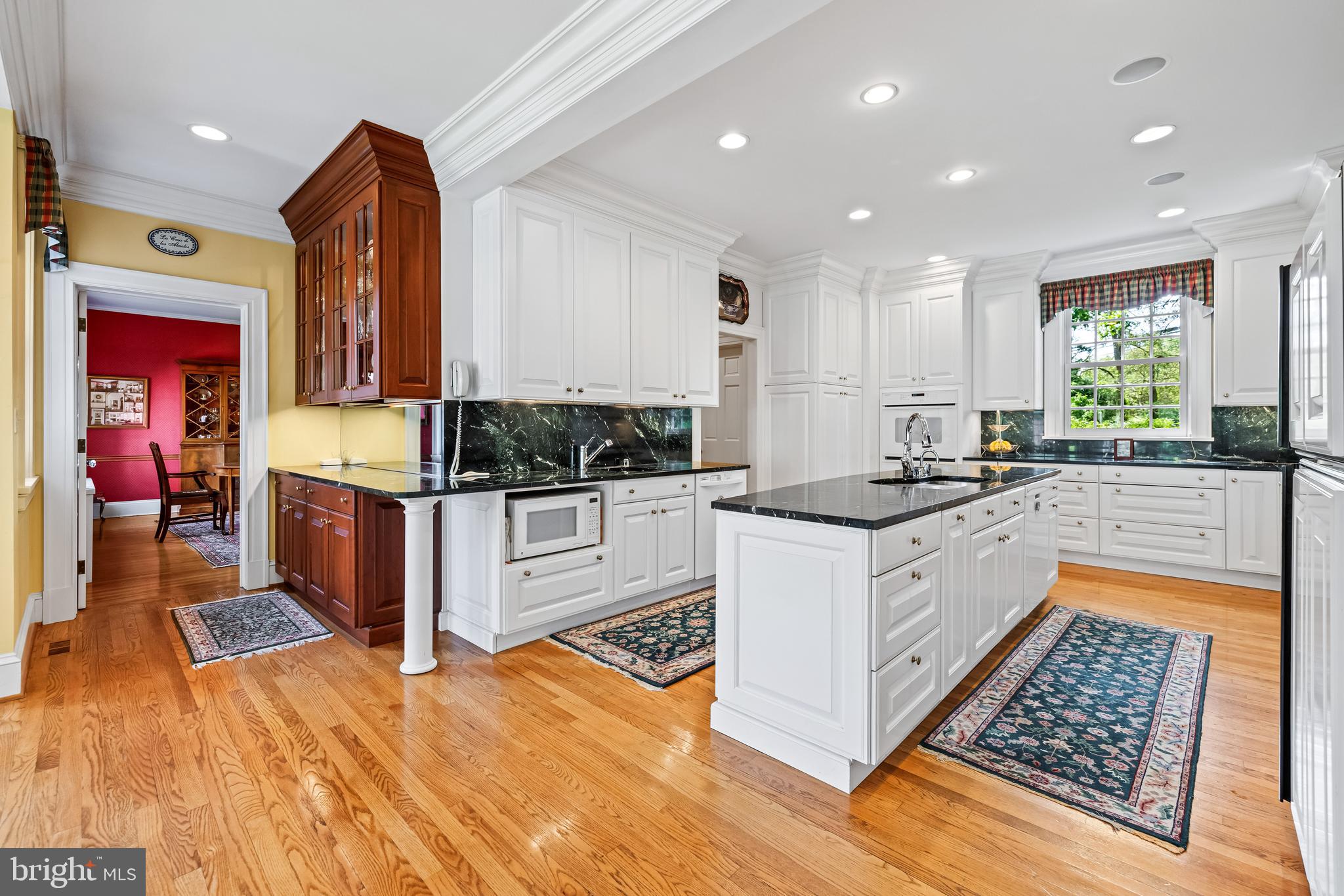 508 Hampton Lane Baltimore, MD 21286 - Photo 21 of 74 a kitchen with stainless steel appliances granite countertop a stove a sink and a microwave