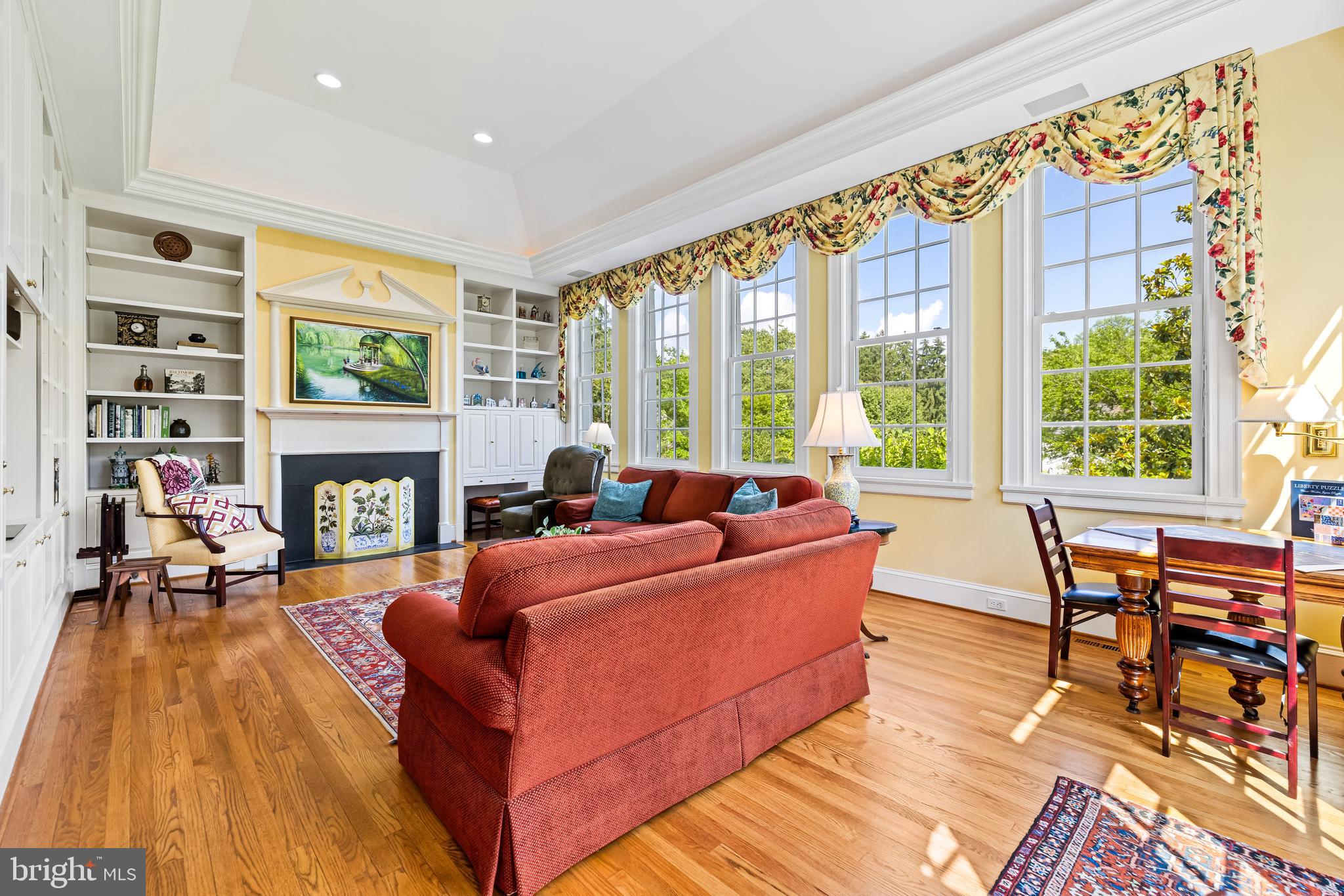 508 Hampton Lane Baltimore, MD 21286 - Photo 26 of 74 a living room with furniture a large window and a fireplace