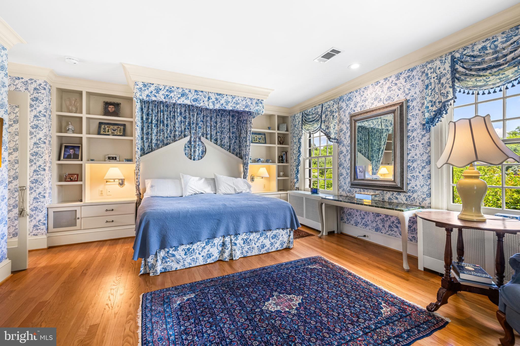 508 Hampton Lane Baltimore, MD 21286 - Photo 36 of 74 a bedroom with a bed a dresser with wooden floor