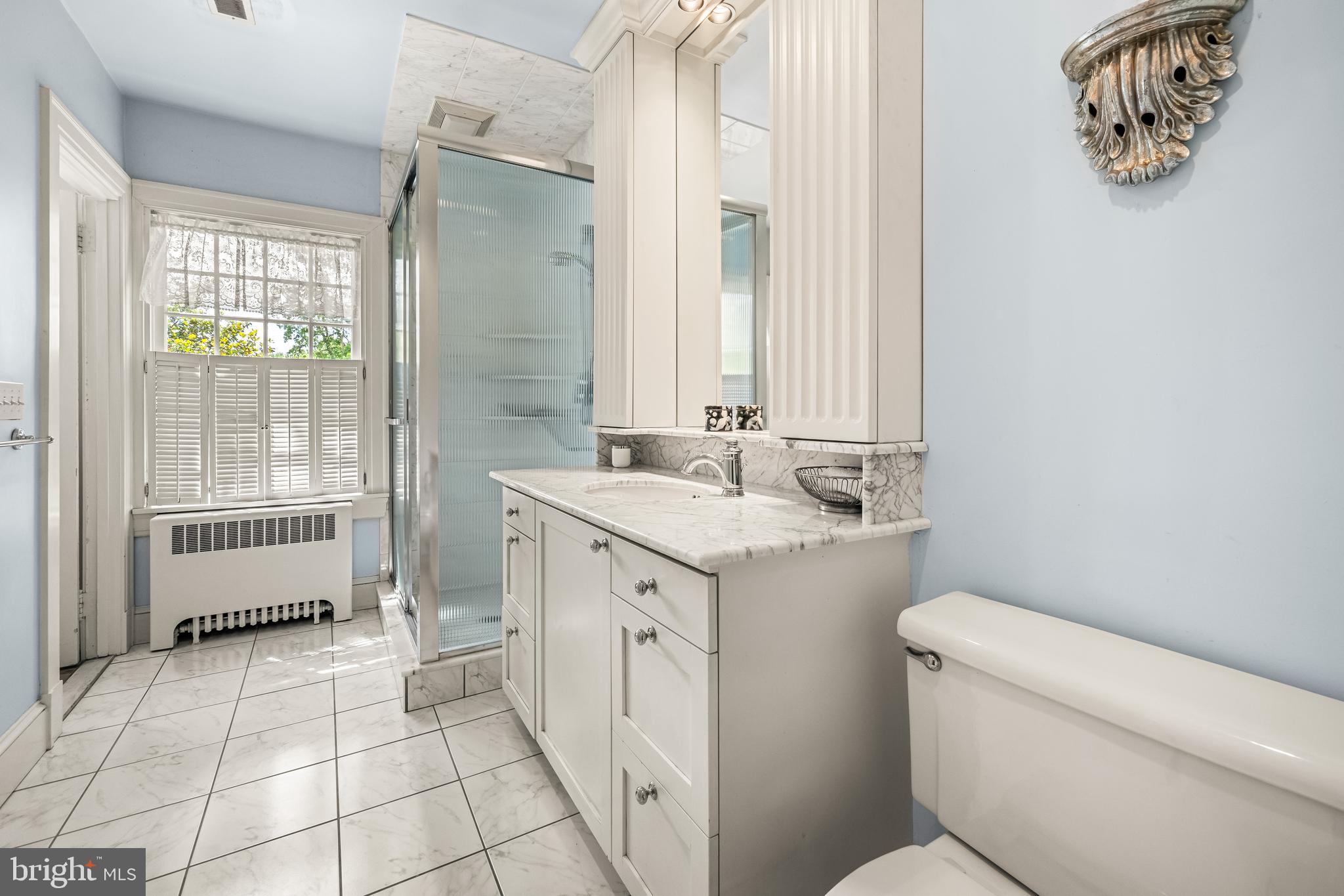 508 Hampton Lane Baltimore, MD 21286 - Photo 44 of 74 a bathroom with a sink a toilet and shower