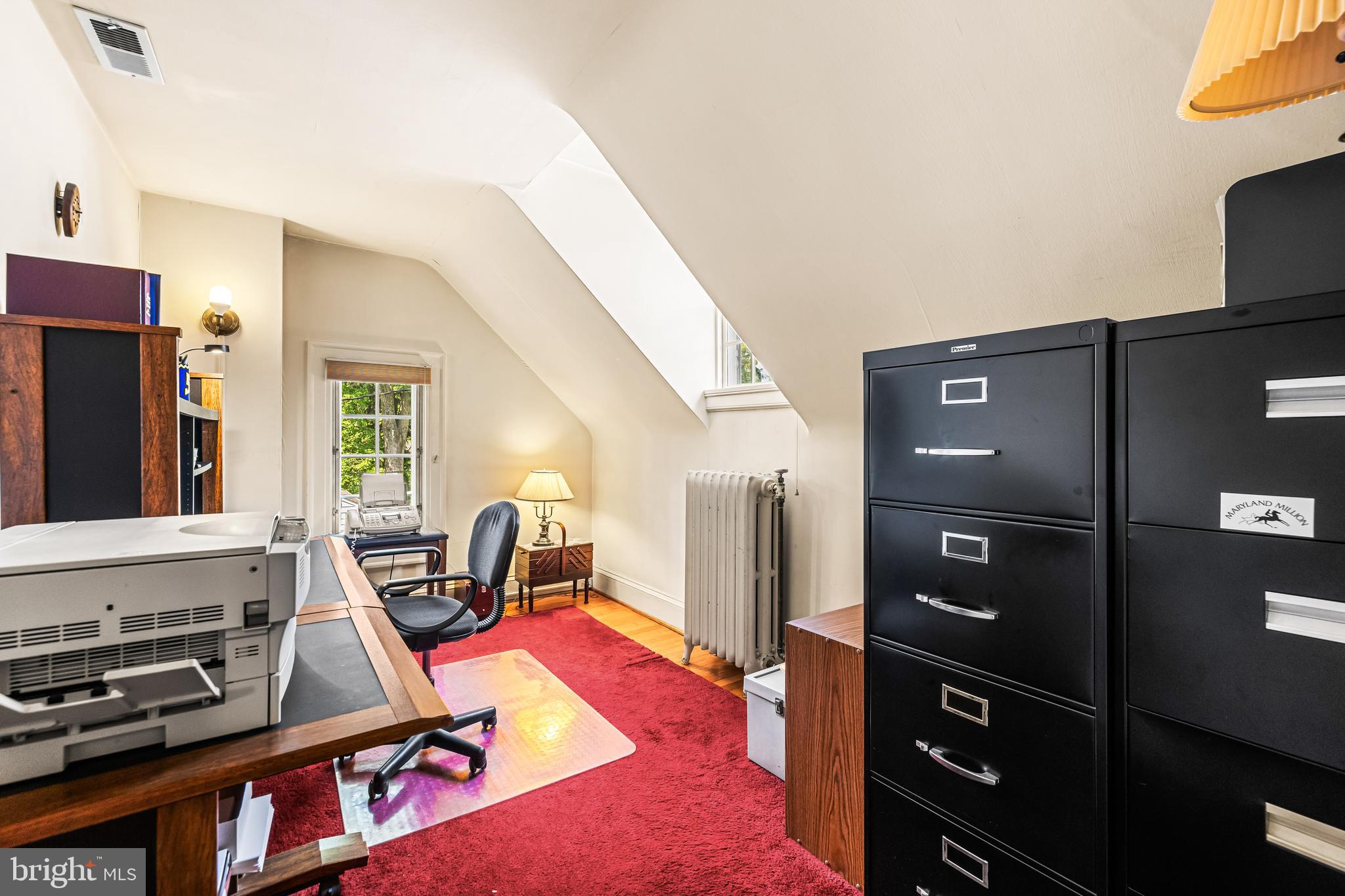 508 Hampton Lane Baltimore, MD 21286 - Photo 46 of 74 a living room with furniture a flat screen tv and a refrigerator