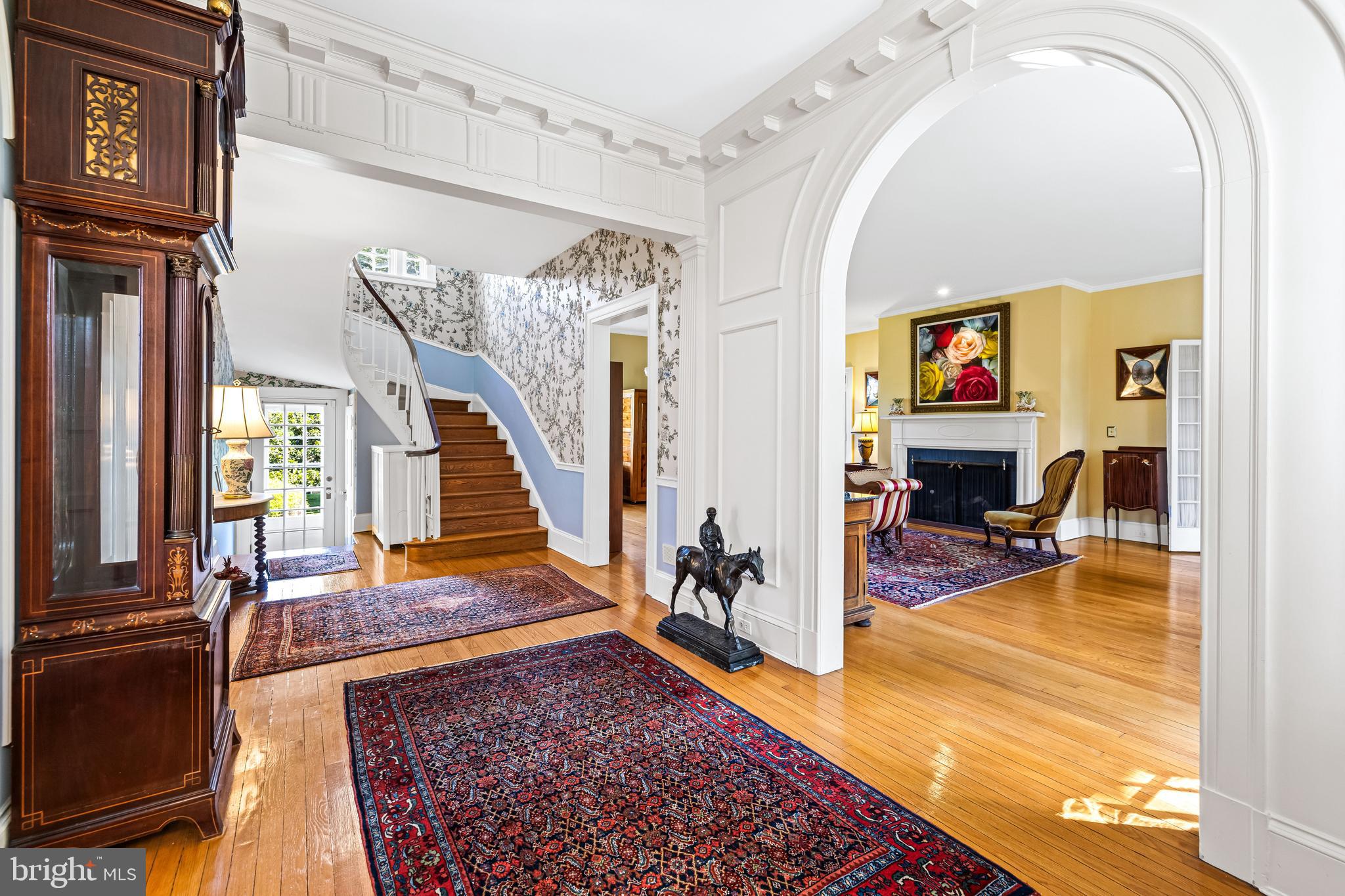 508 Hampton Lane Baltimore, MD 21286 - Photo 5 of 74 a view of a livingroom with furniture a flat screen tv and entryway