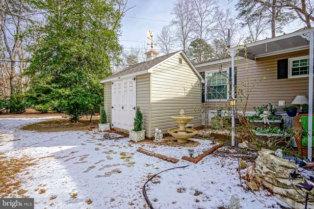 a view of a backyard with chairs