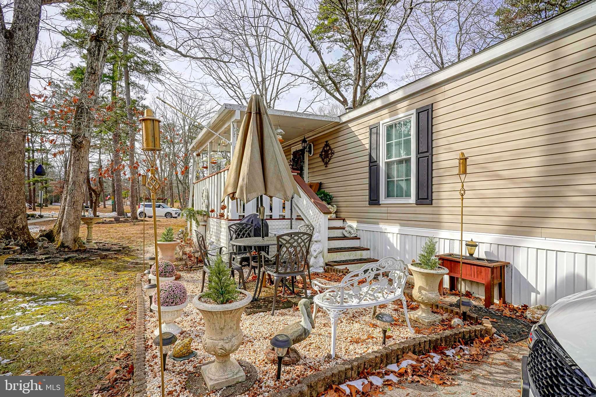 3 Dogwood East Tabernacle, NJ 08088 - Photo 23 of 25 a view of a patio with table and chairs and potted plants