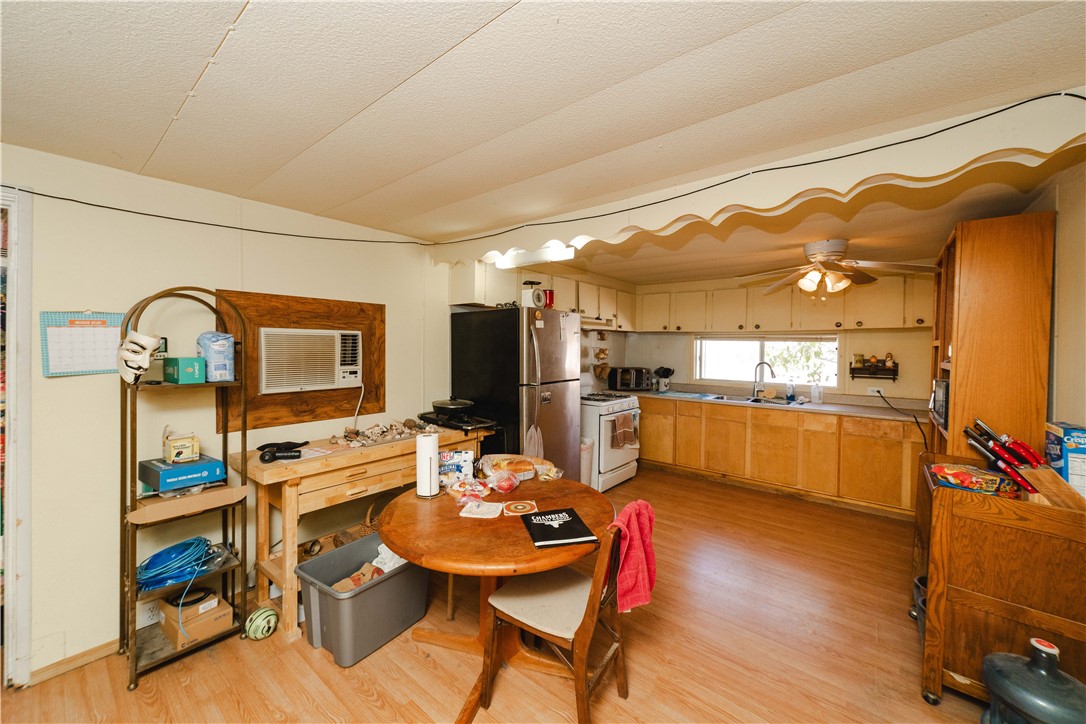 9769 North Rose Quartz Road Chloride, AZ 86431 - Photo 36 of 91 a living room with stainless steel appliances kitchen island granite countertop furniture and a view of kitchen