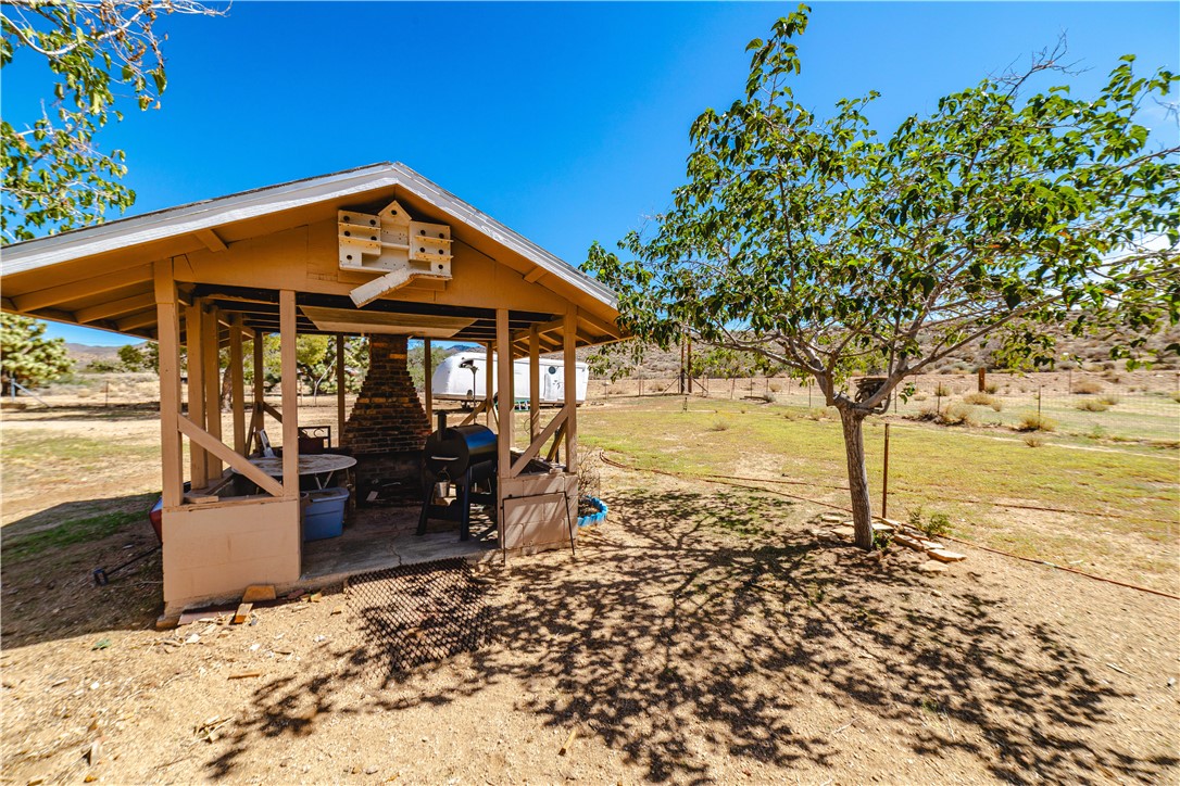 9769 North Rose Quartz Road Chloride, AZ 86431 - Photo 40 of 91 a view of a house with backyard porch and sitting area