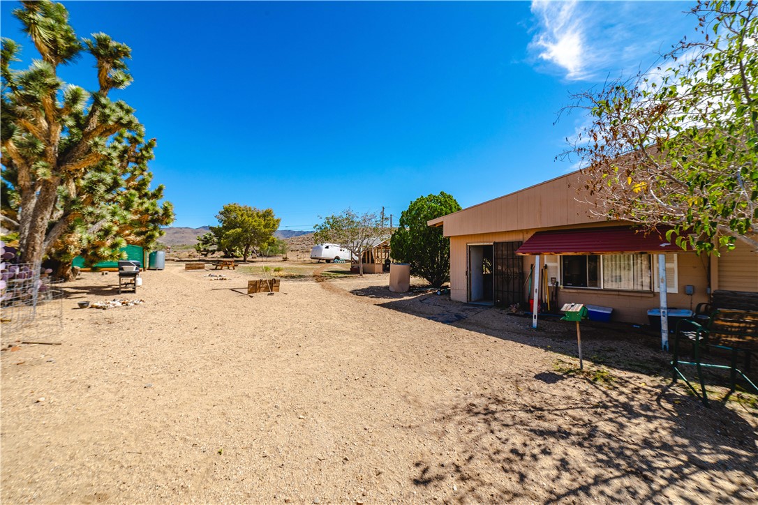 9769 North Rose Quartz Road Chloride, AZ 86431 - Photo 50 of 91 a view of patio with a table and chairs under an umbrella