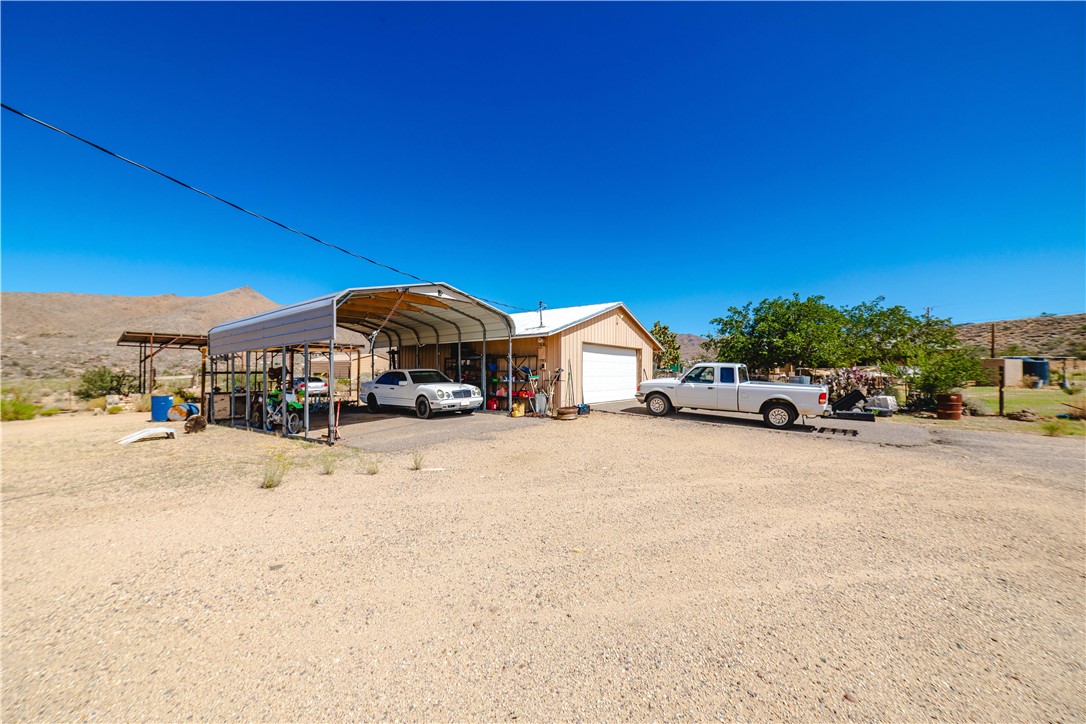 9769 North Rose Quartz Road Chloride, AZ 86431 - Photo 68 of 91 a car parked in front of a house