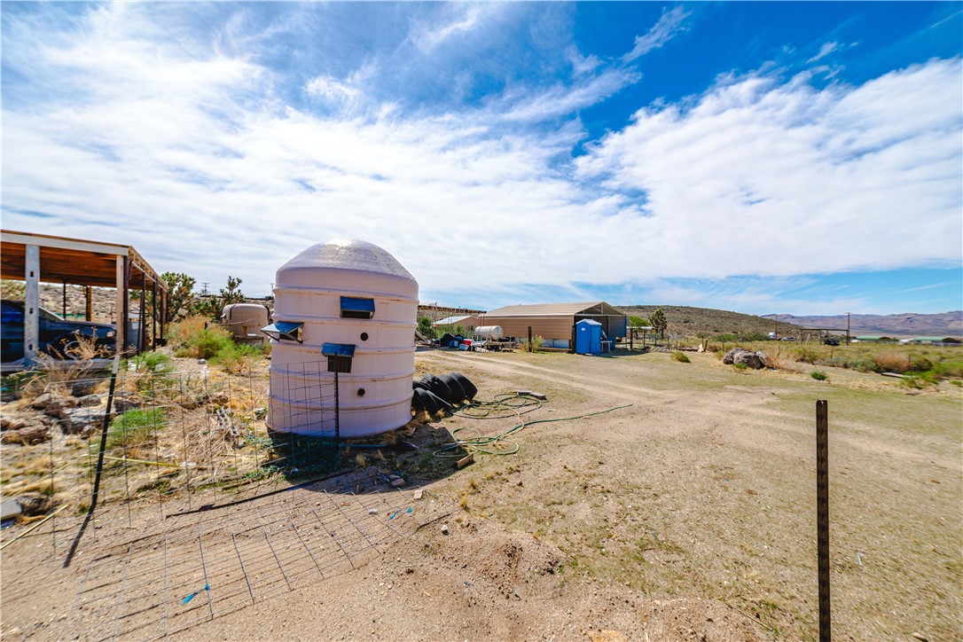 9769 North Rose Quartz Road Chloride, AZ 86431 - Photo 88 of 91 a view of a dry yard with wooden fence