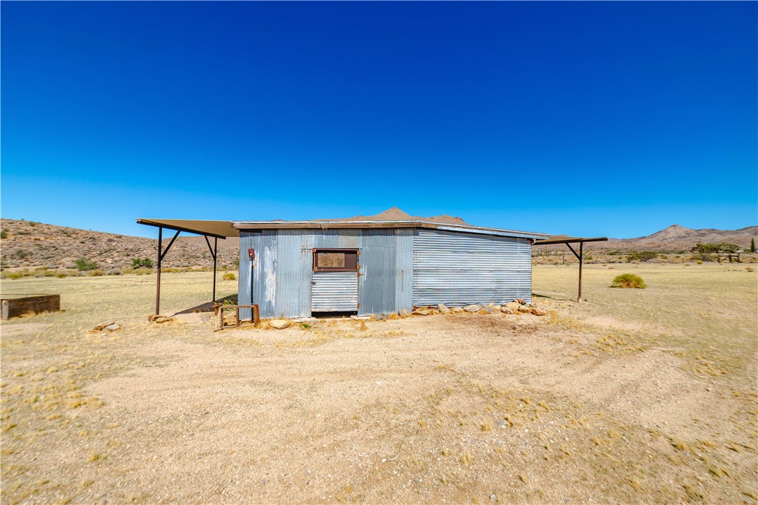 9769 North Rose Quartz Road Chloride, AZ 86431 - Photo 9 of 91 a view of a yard with a house