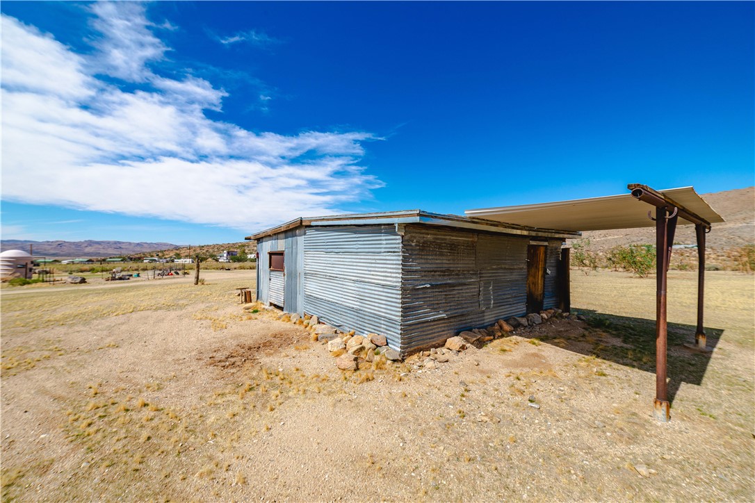 9769 North Rose Quartz Road Chloride, AZ 86431 - Photo 10 of 91 a view of a house with a snow in the yard