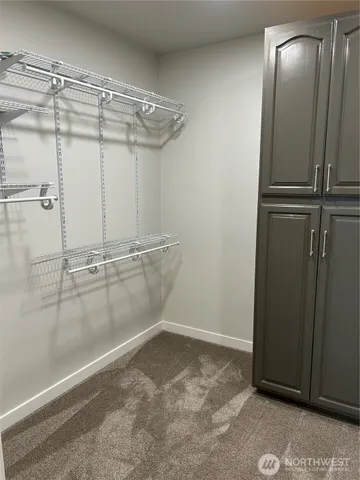 a view of a room with racks on the wall