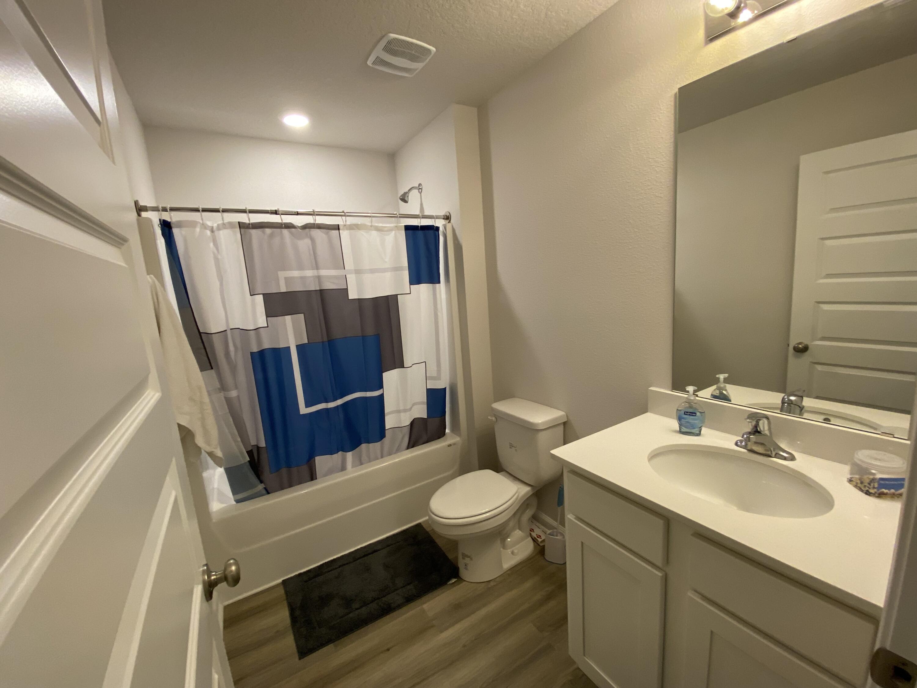 337 Flounder Street Crestview, FL 32539 - Photo 13 of 46 a bathroom with a sink a toilet a mirror and shower