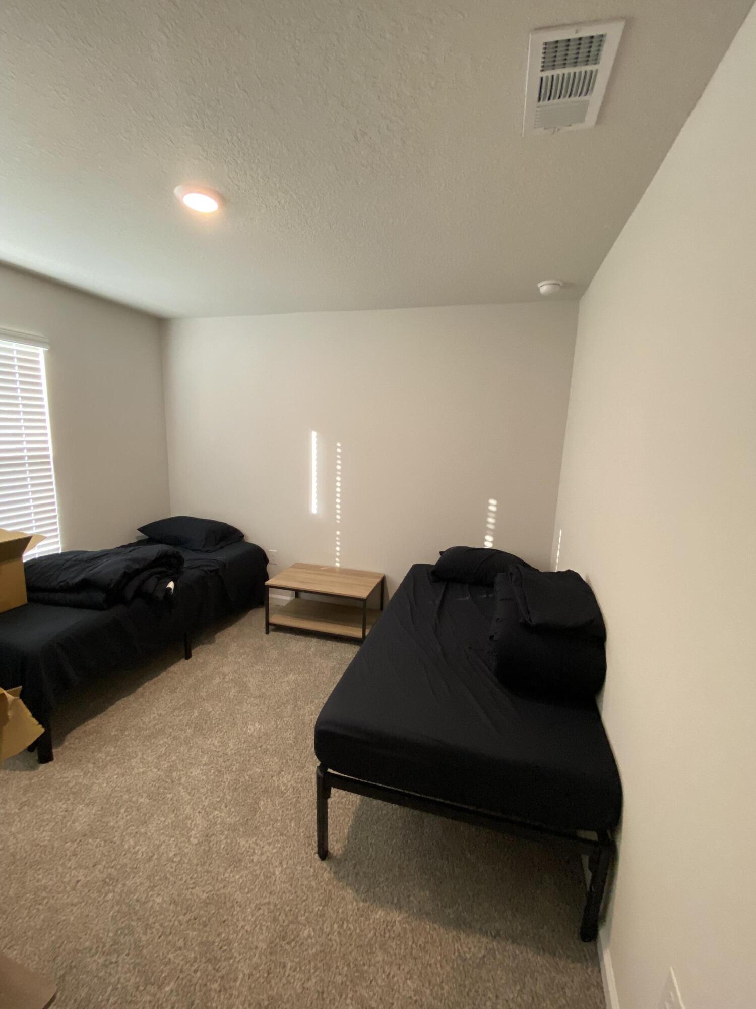 337 Flounder Street Crestview, FL 32539 - Photo 14 of 46 a living room with furniture and a lamp