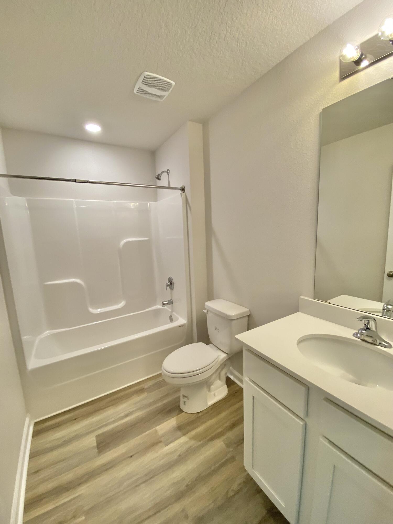 337 Flounder Street Crestview, FL 32539 - Photo 15 of 53 a bathroom with a sink toilet tub and shower