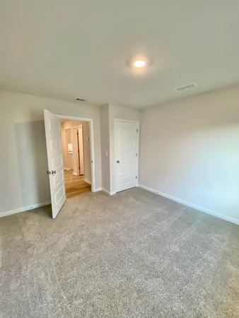 a living room with stainless steel appliances kitchen island granite countertop furniture and a refrigerator