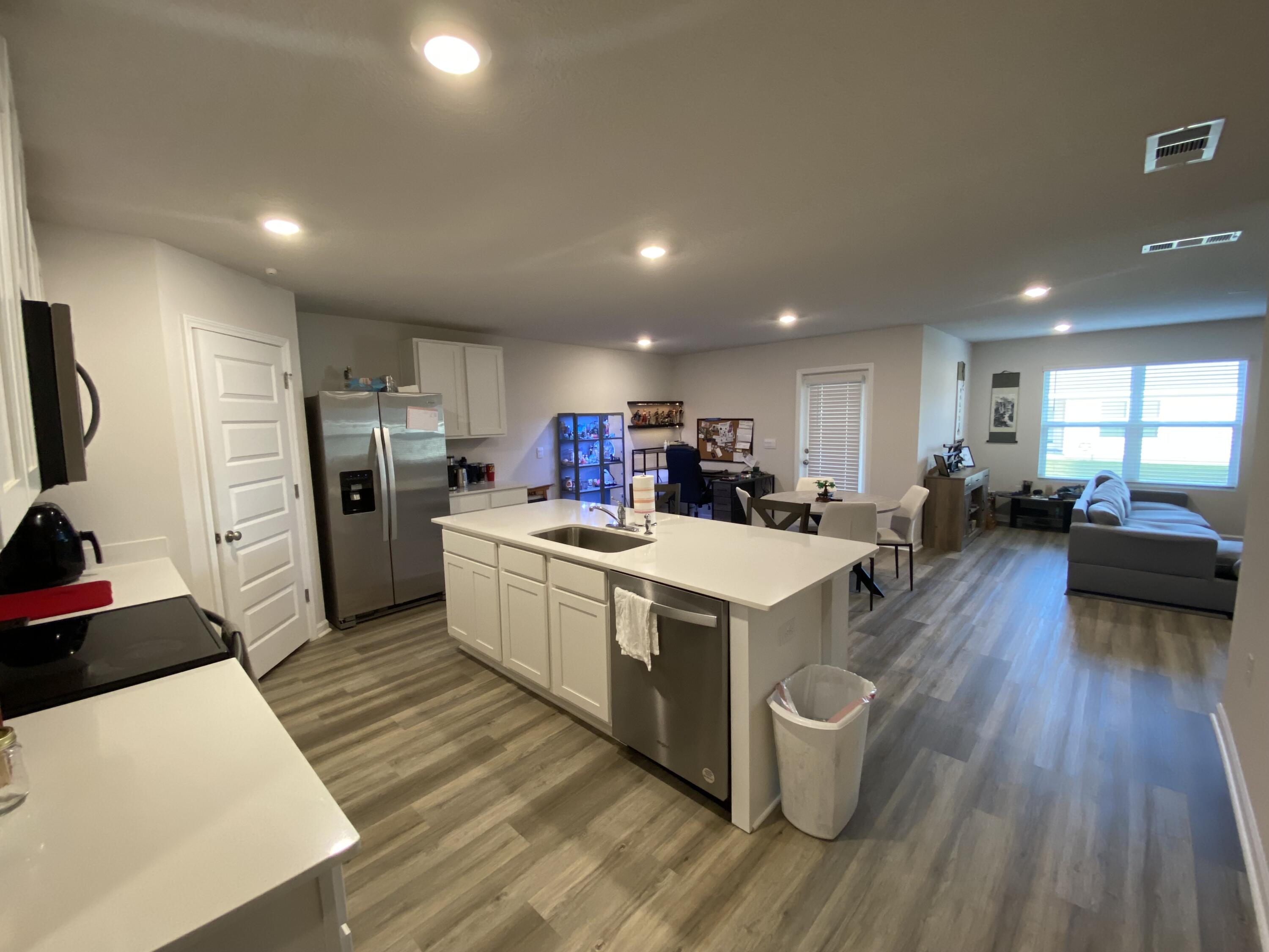 337 Flounder Street Crestview, FL 32539 - Photo 18 of 46 a large kitchen with stainless steel appliances a large counter top a sink a refrigerator and a stove