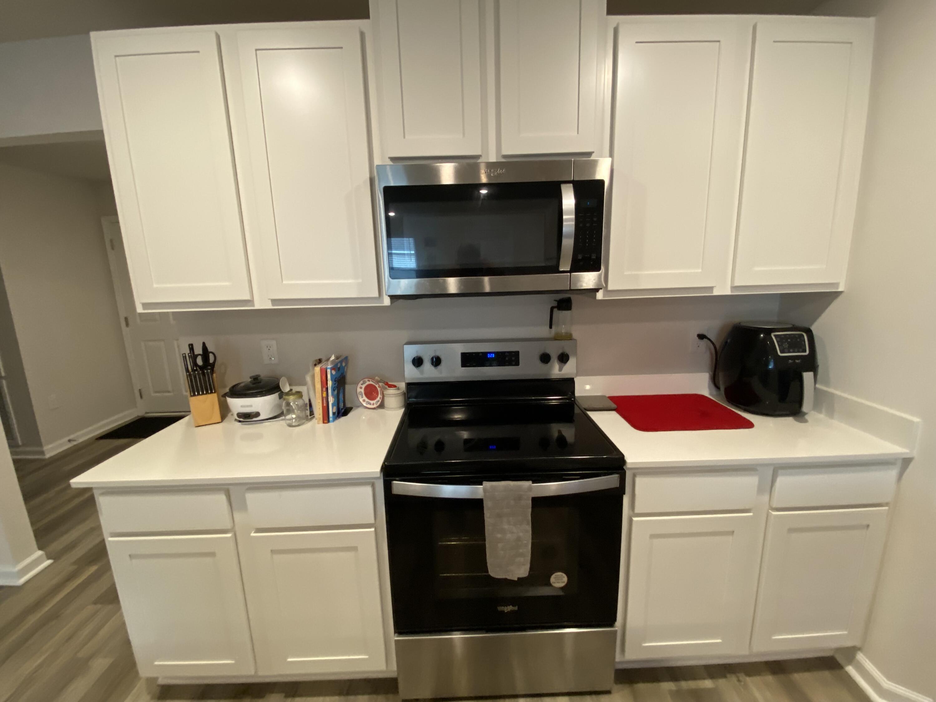 337 Flounder Street Crestview, FL 32539 - Photo 20 of 46 a kitchen with a stove and a microwave