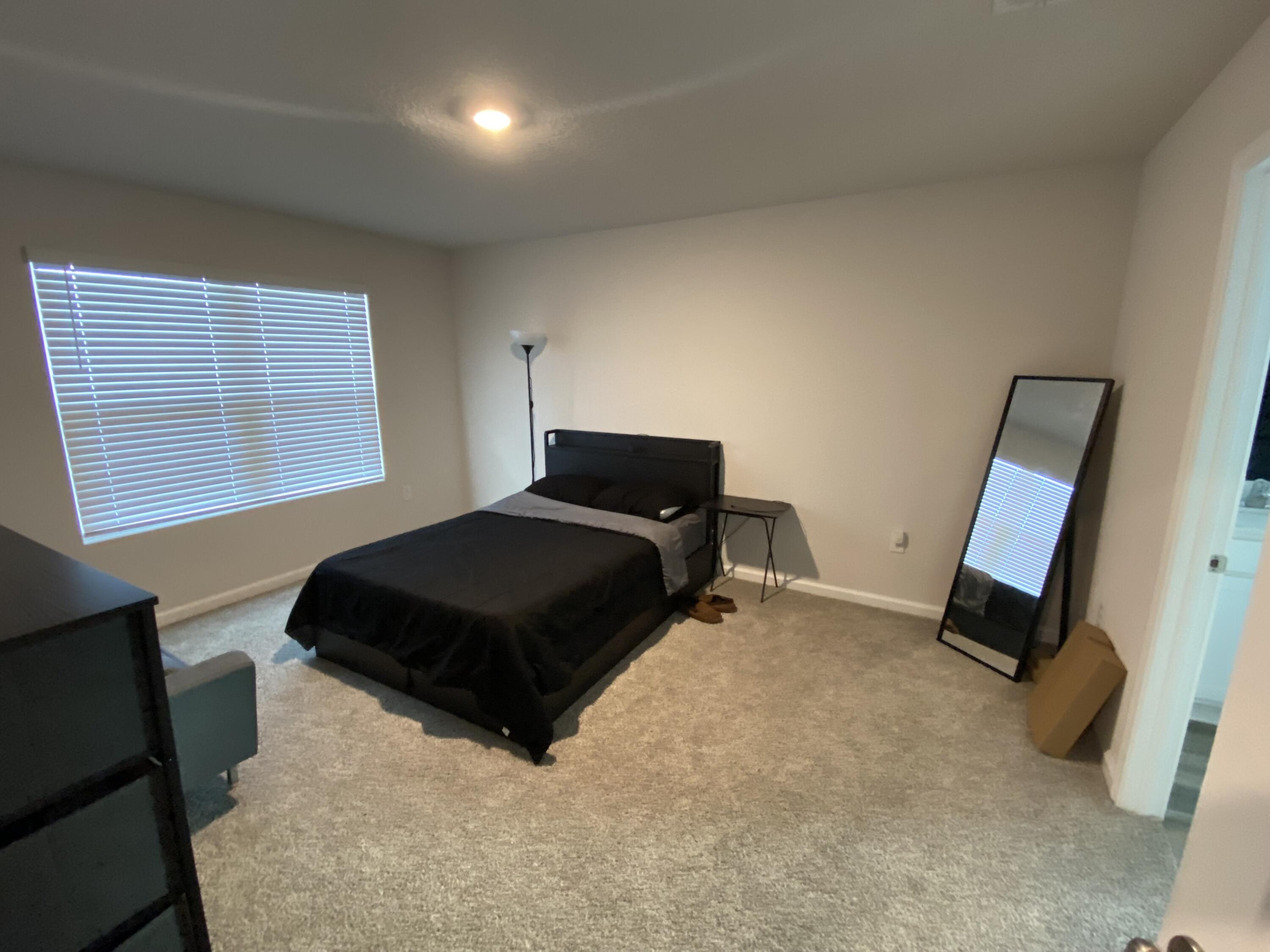 337 Flounder Street Crestview, FL 32539 - Photo 30 of 46 a bedroom with a bed and a window