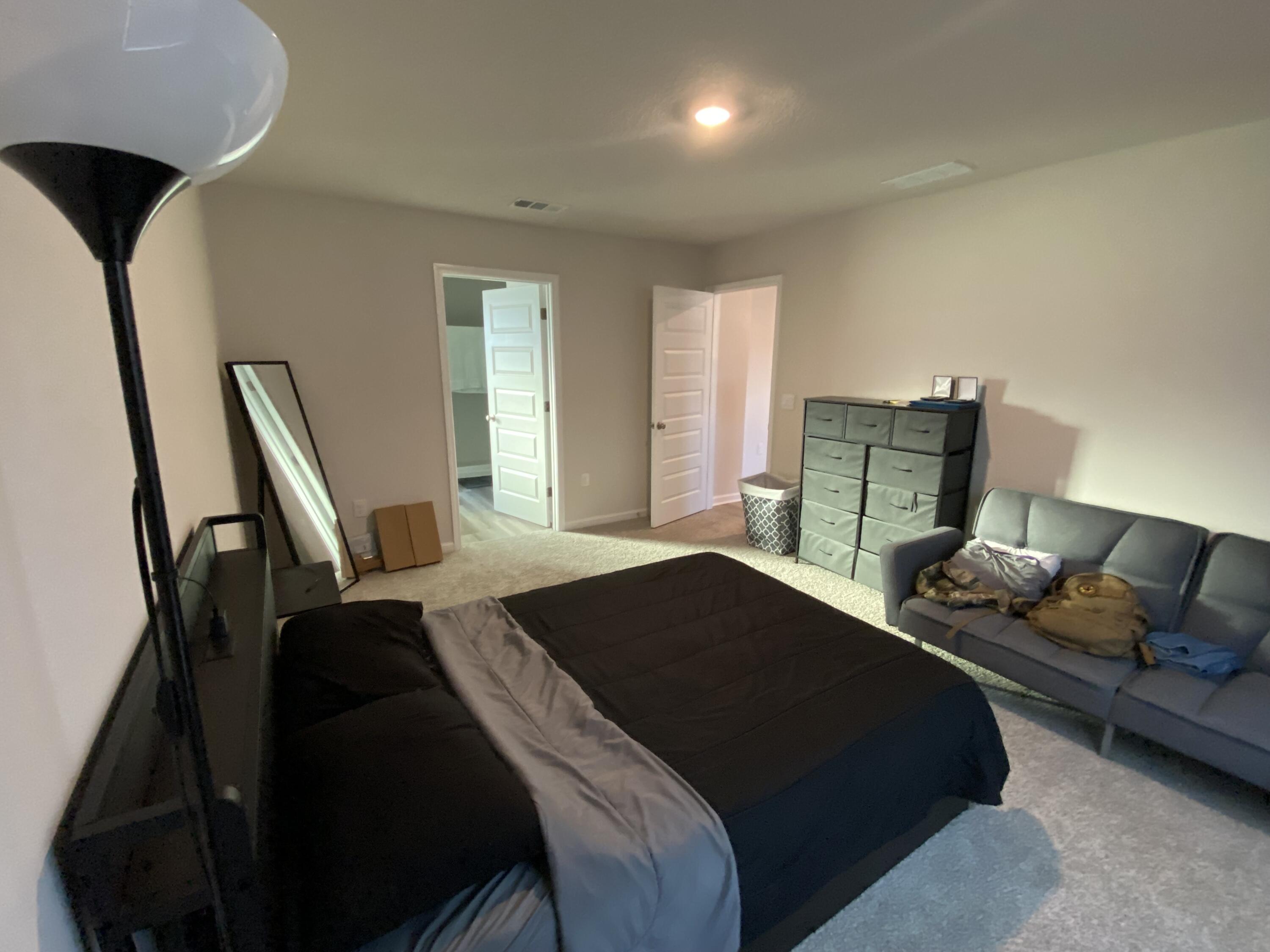 337 Flounder Street Crestview, FL 32539 - Photo 31 of 46 a bedroom with a bed couch and a window