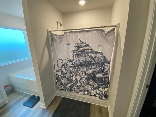 a view of entryway with wooden floor