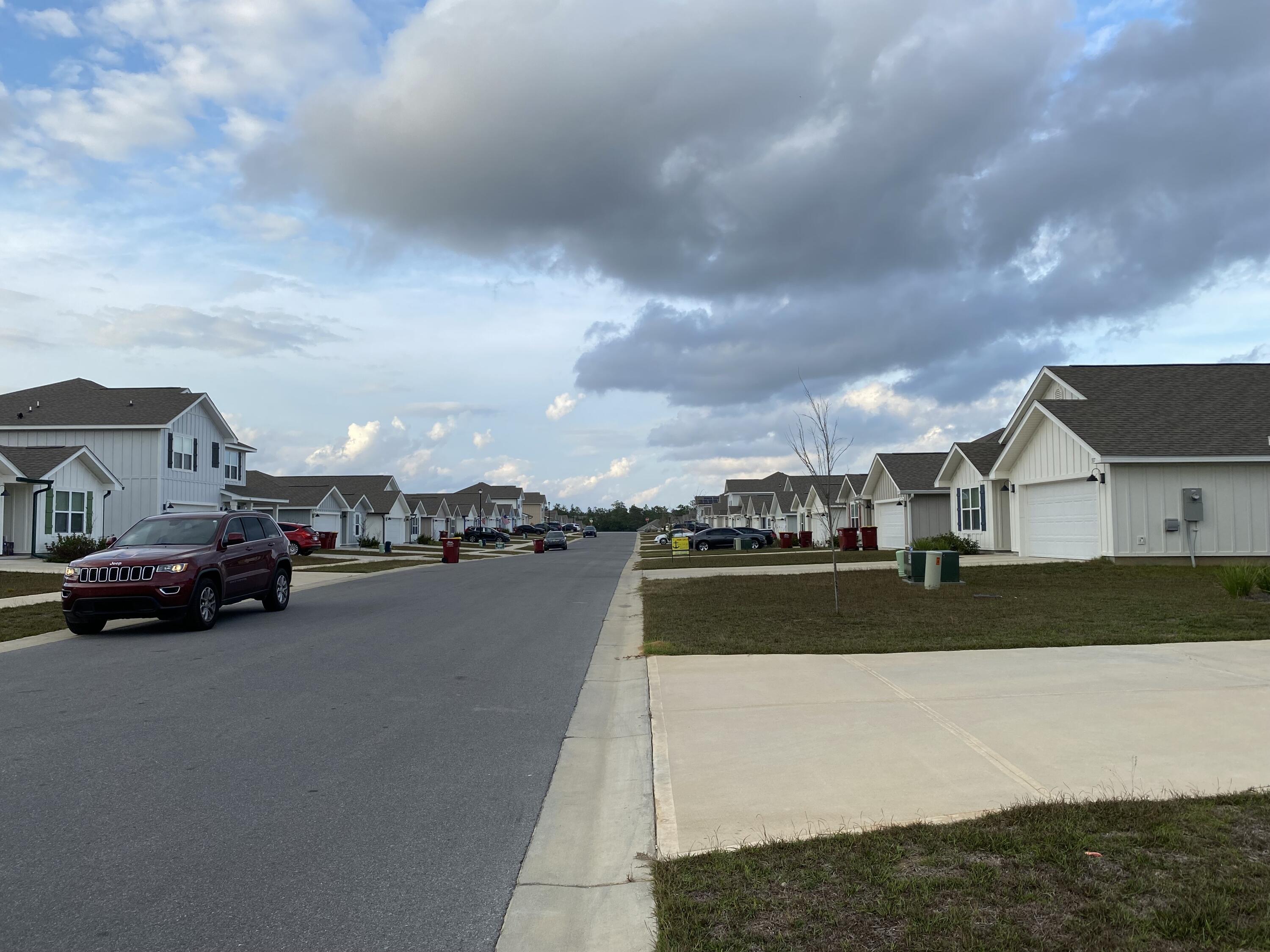 337 Flounder Street Crestview, FL 32539 - Photo 36 of 46 a view of city street with a car parked in front of it