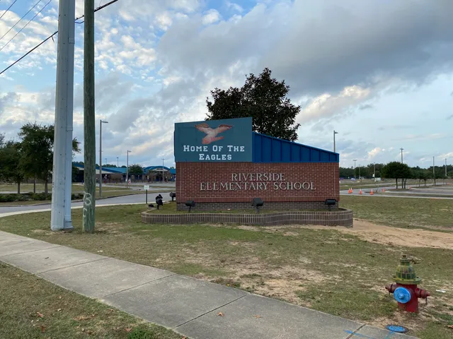 a view of a street with a building in the background