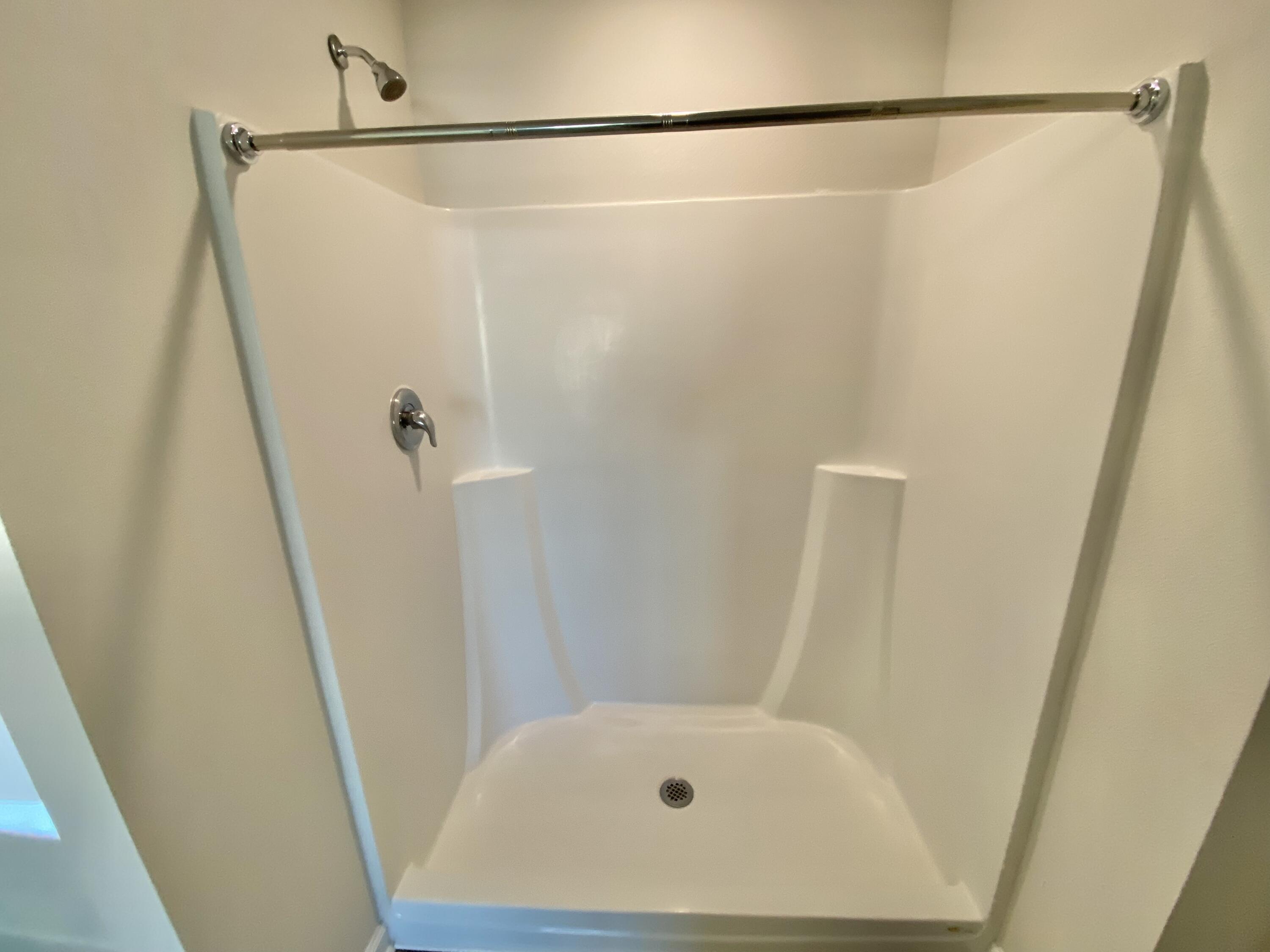 337 Flounder Street Crestview, FL 32539 - Photo 42 of 53 a bathroom with a shower and a tub