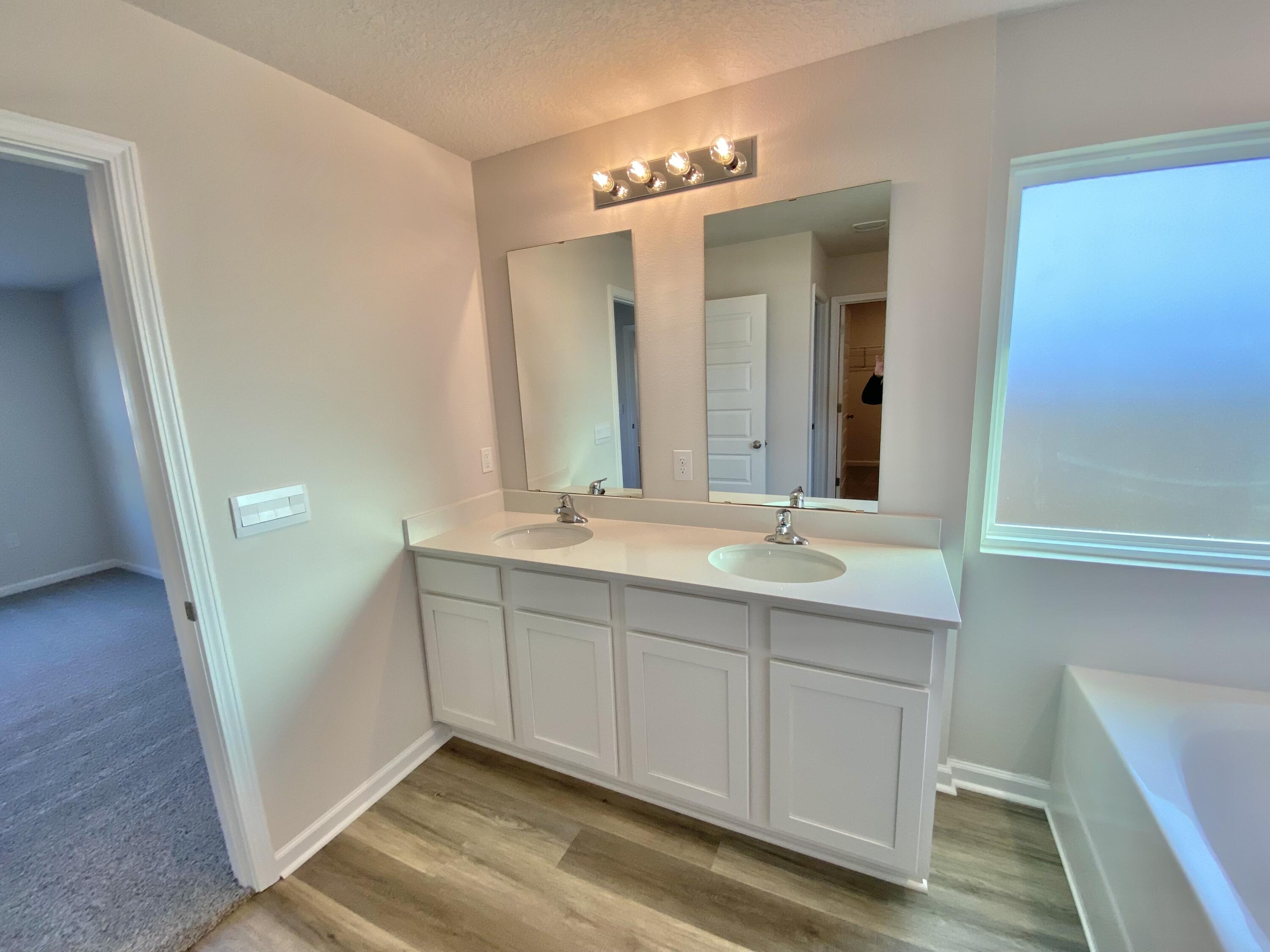 337 Flounder Street Crestview, FL 32539 - Photo 44 of 53 a bathroom with a double vanity sink and mirror