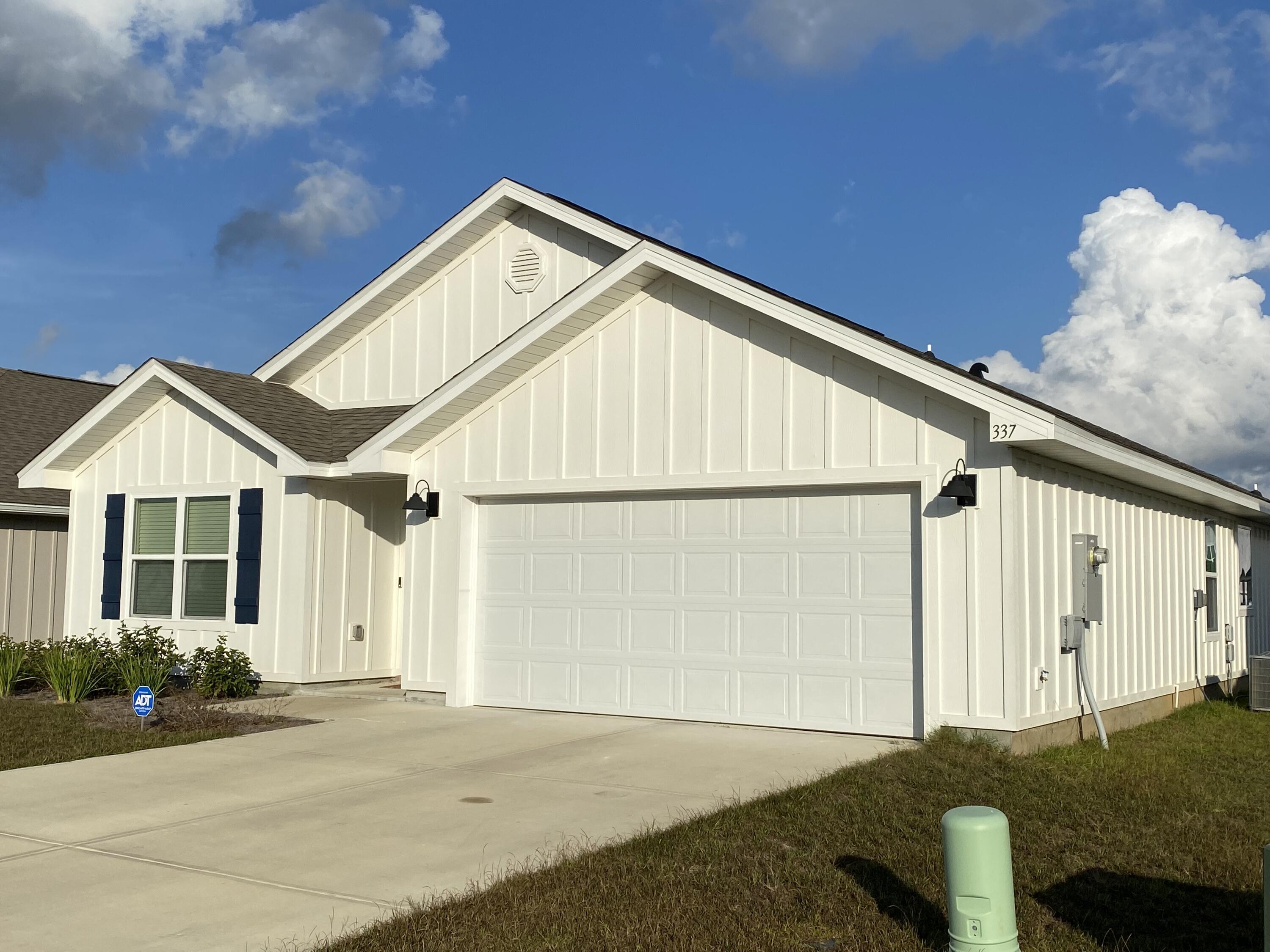 337 Flounder Street Crestview, FL 32539 - Photo 8 of 53 a front view of a house with a yard