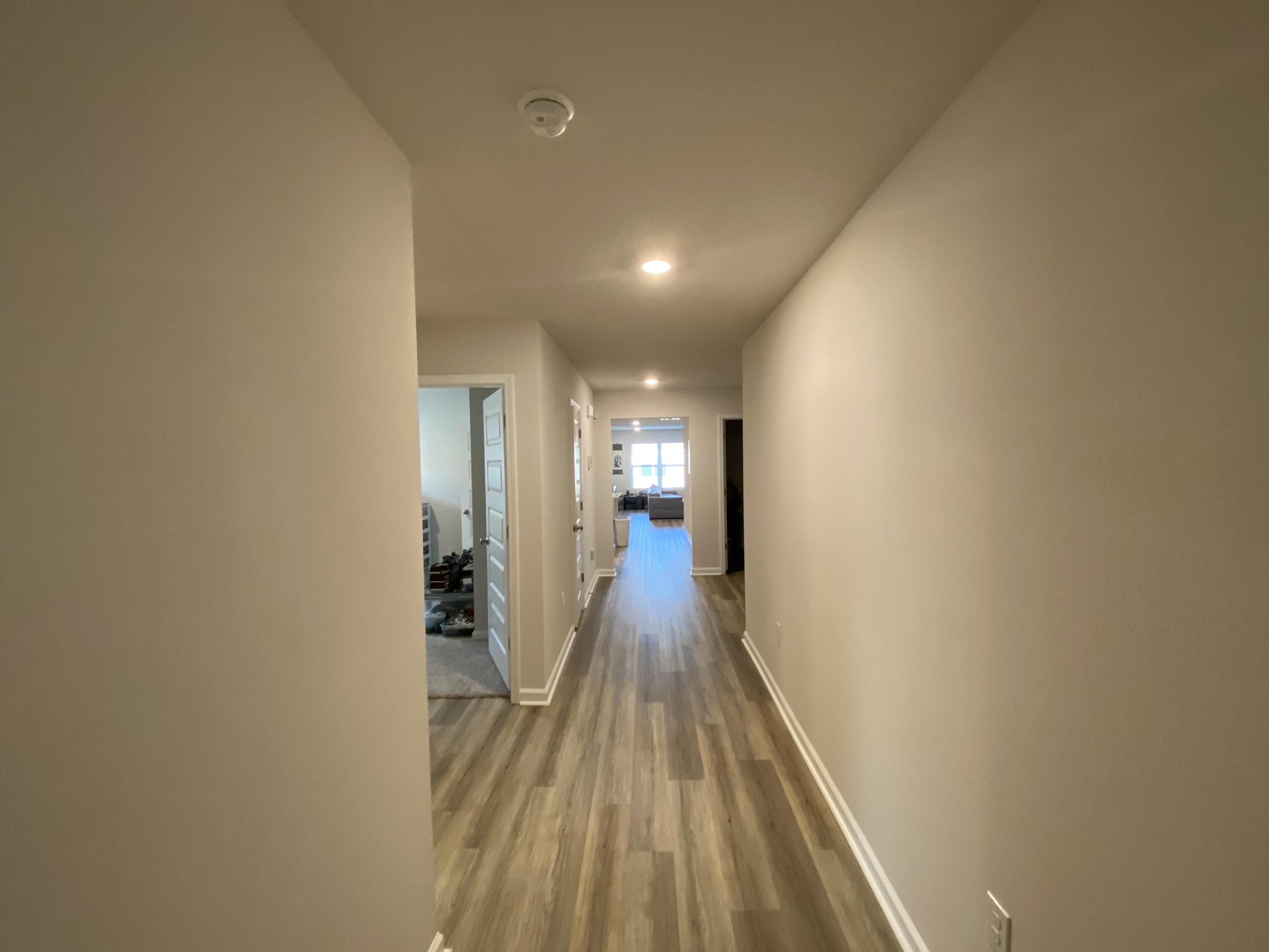 337 Flounder Street Crestview, FL 32539 - Photo 9 of 46 a view of a hallway with wooden floor