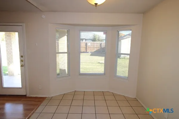 a view of an empty room and window