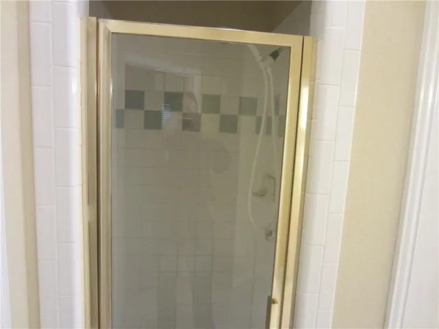 a bathroom with a glass door