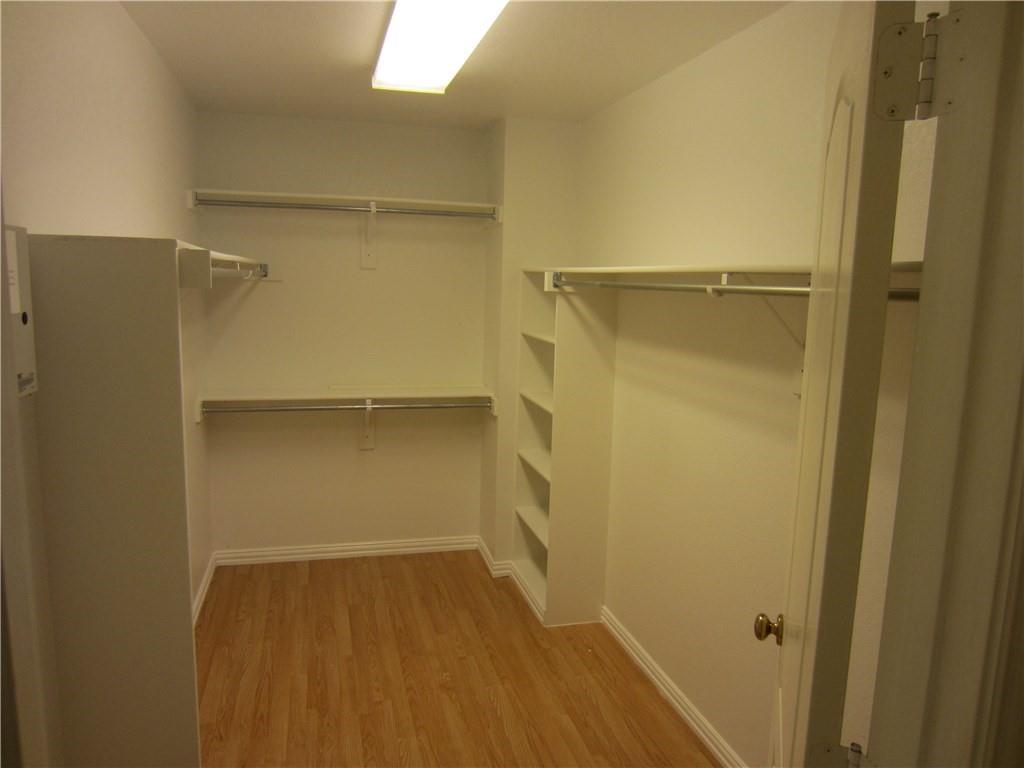 1800 Chester Drive Plano, TX 75025 - Photo 4 of 14 a view of walk in closet with empty racks