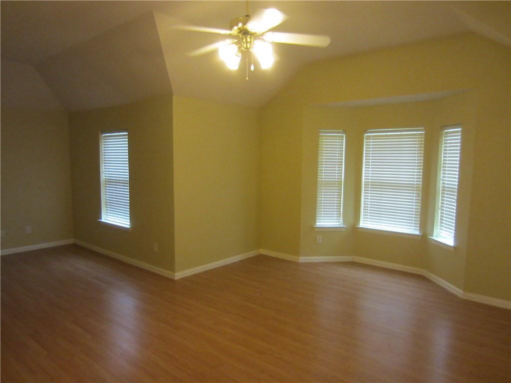 1800 Chester Drive Plano, TX 75025 - Photo 5 of 14 a view of an empty room with window and wooden floor