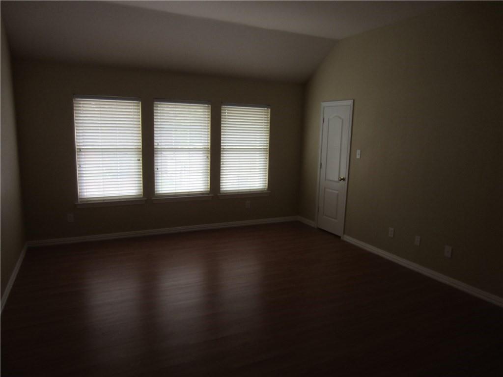 1800 Chester Drive Plano, TX 75025 - Photo 6 of 14 a view of a room with wooden floor and a window