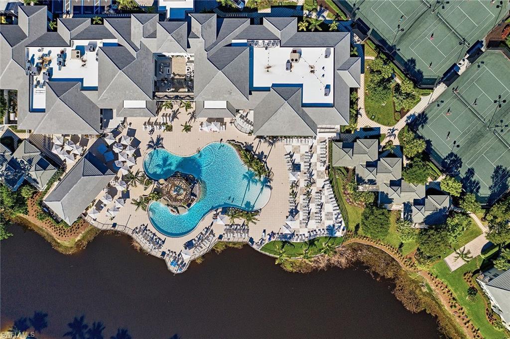 325 Dunes Boulevard, Unit 607 Naples, FL 34110 - Photo 24 of 27 an aerial view of a house with a garden and plants