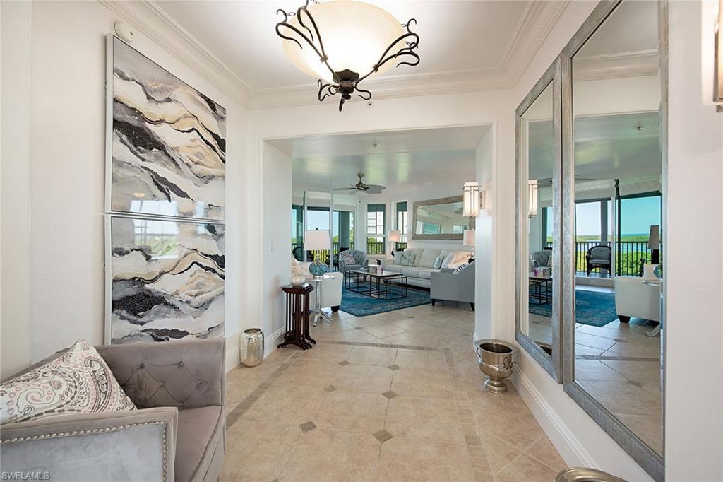 325 Dunes Boulevard, Unit 607 Naples, FL 34110 - Photo 10 of 27 a view of a living room and a balcony