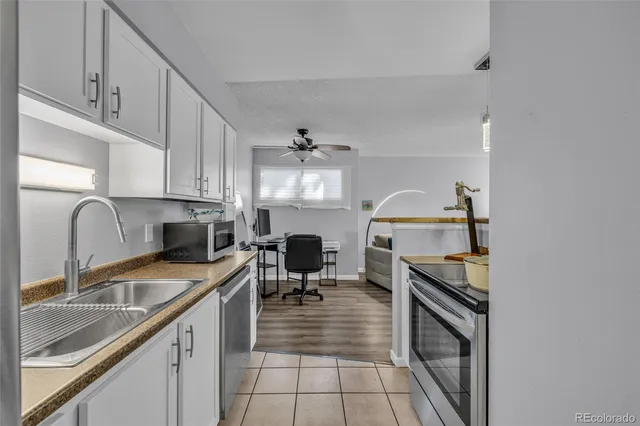 a bedroom with bed and wooden floor