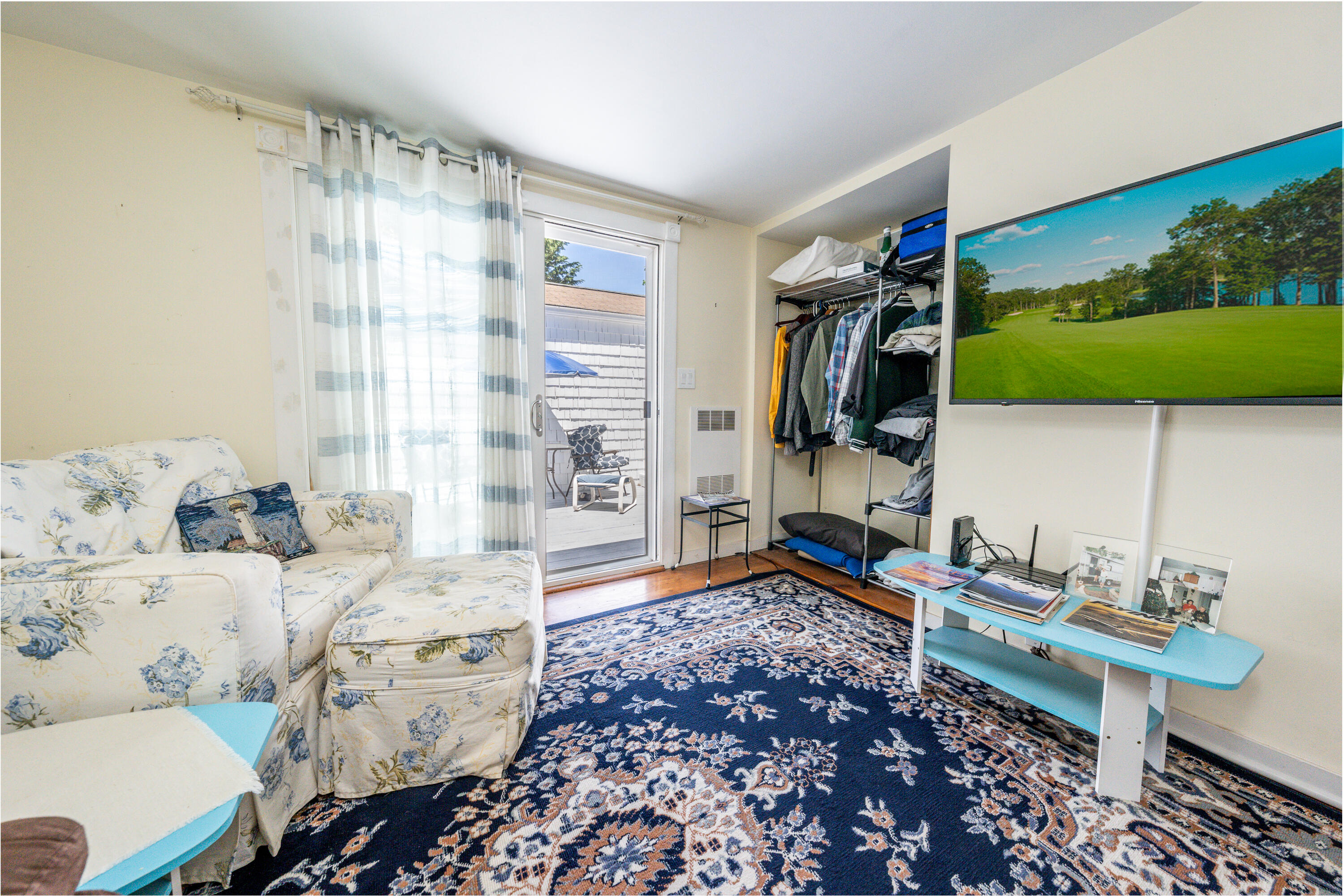 40 Seabrook Road Hyannis, MA 02601 - Photo 16 of 45 a living room with furniture and a flat screen tv