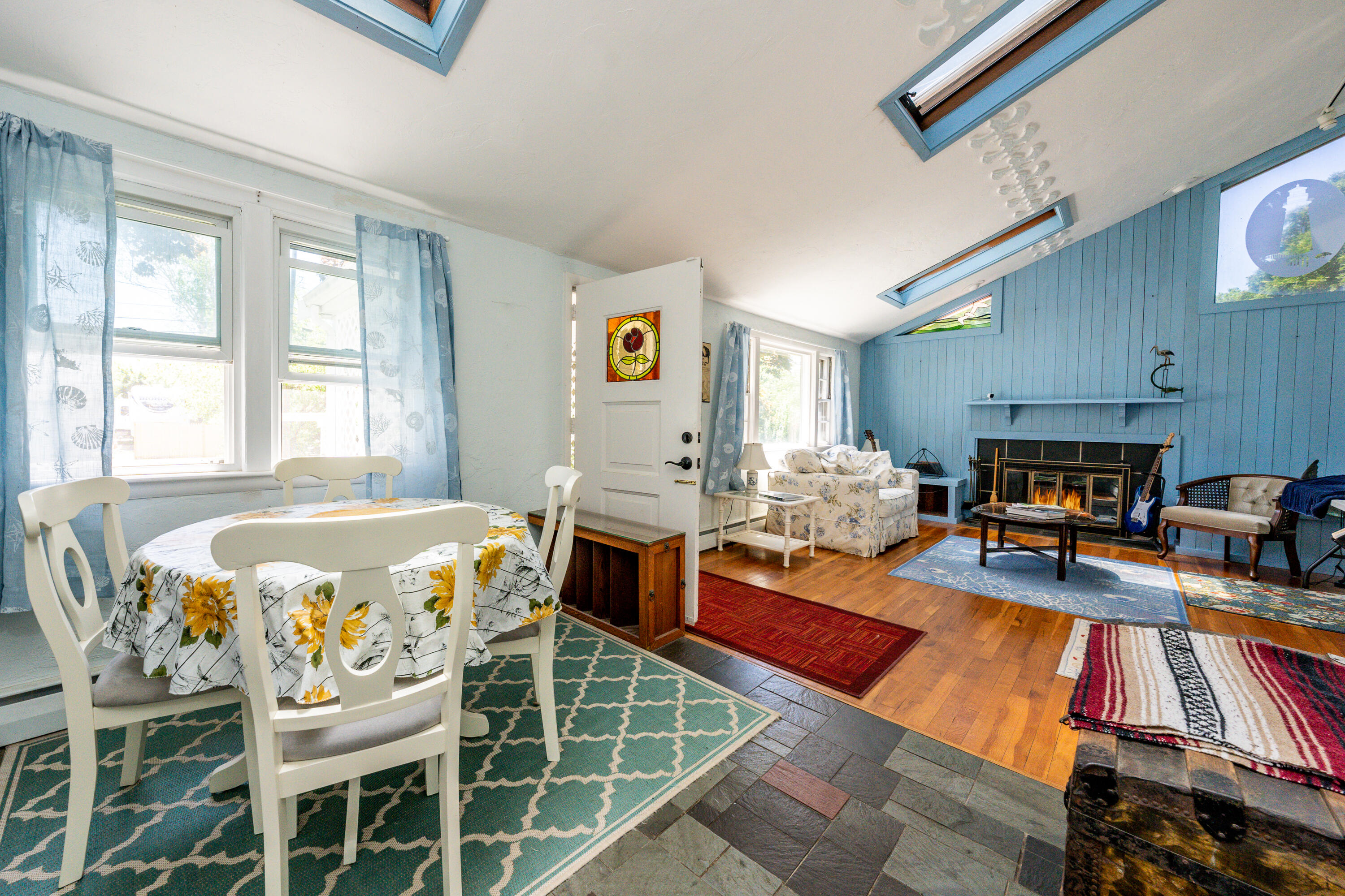40 Seabrook Road Hyannis, MA 02601 - Photo 6 of 45 a living room with furniture a fireplace and a flat screen tv