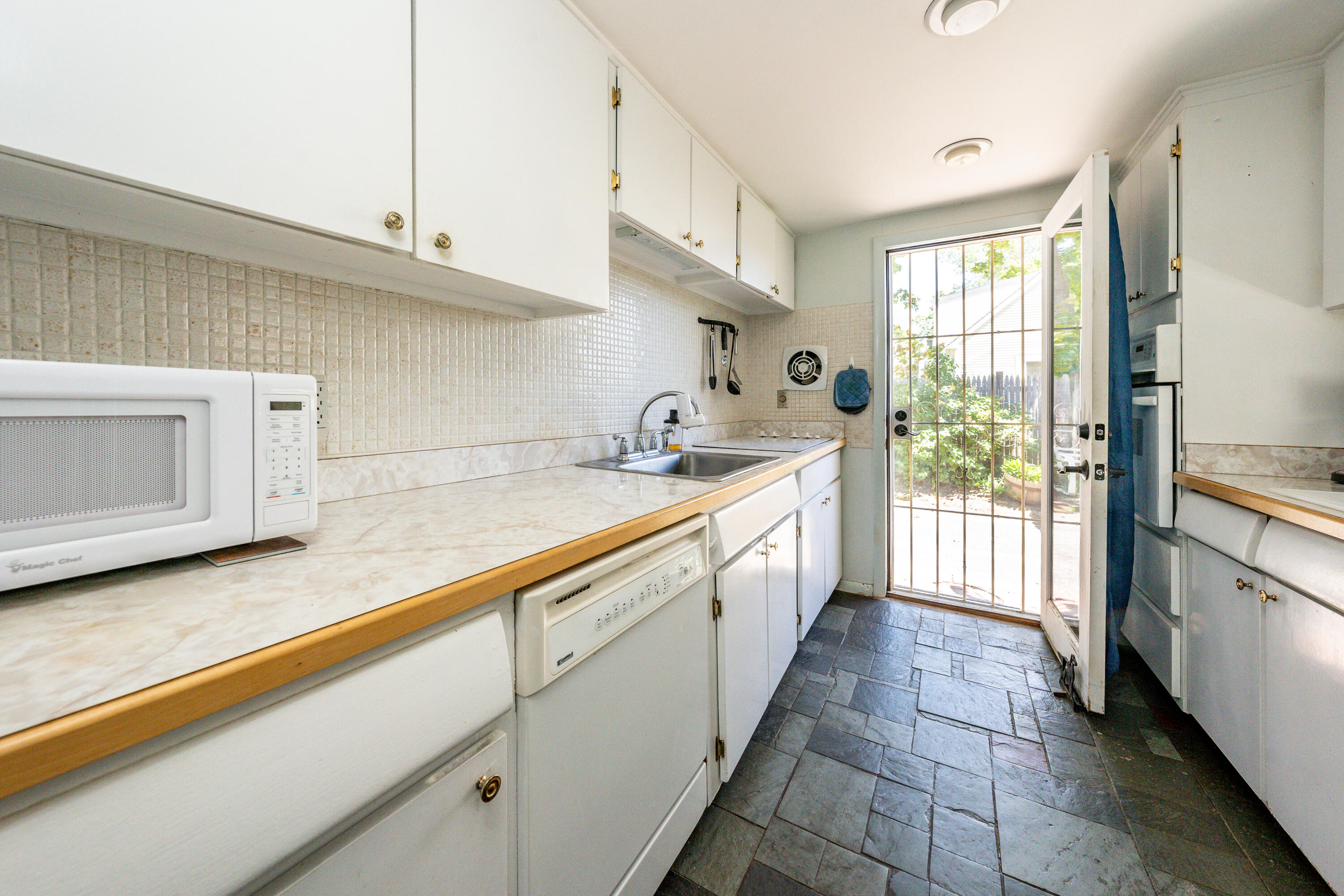 40 Seabrook Road Hyannis, MA 02601 - Photo 10 of 45 a kitchen with sink cabinets and window