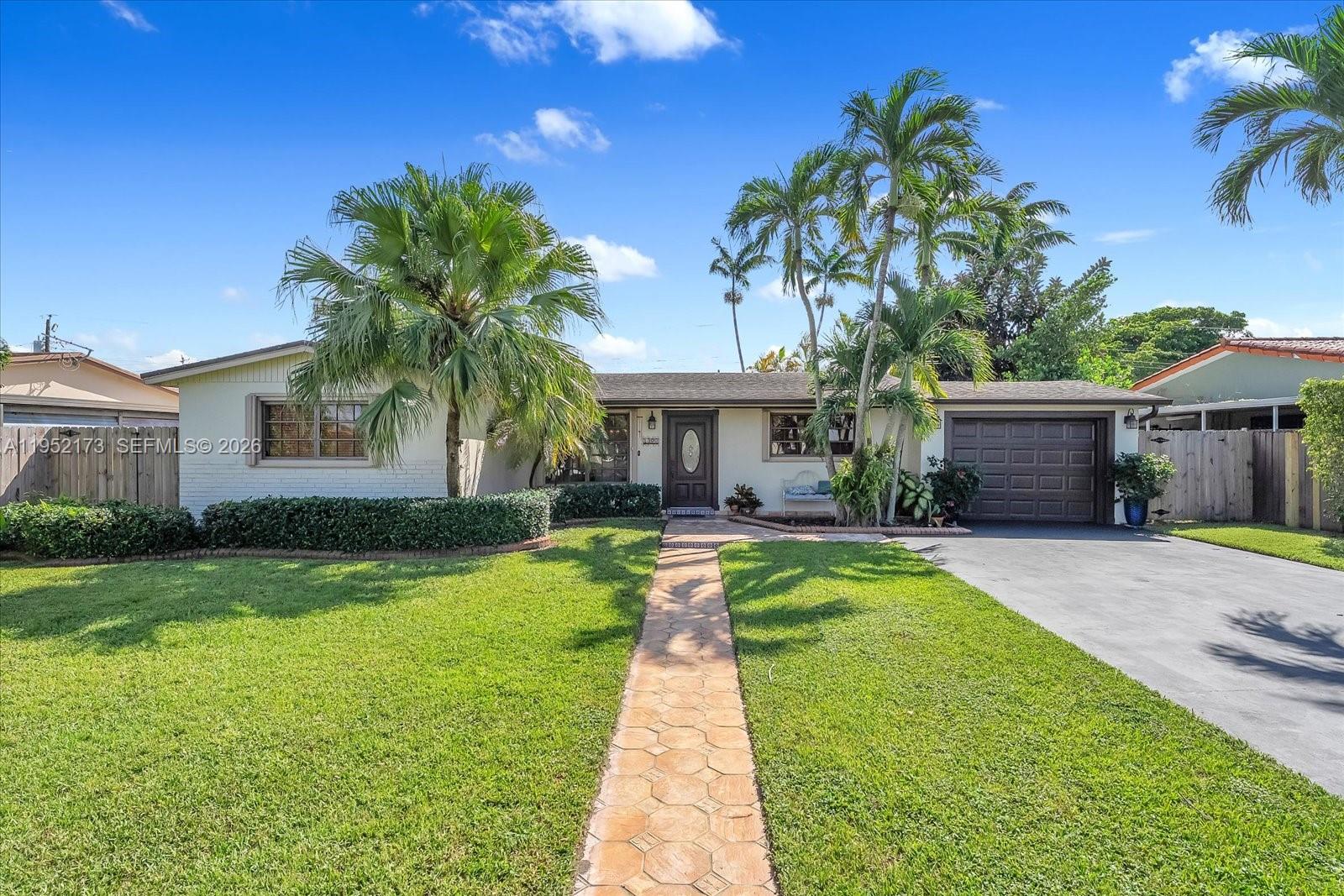 1300 West 77th Street Hialeah, FL 33014 - Photo 2 of 41 a front view of house with yard and green space