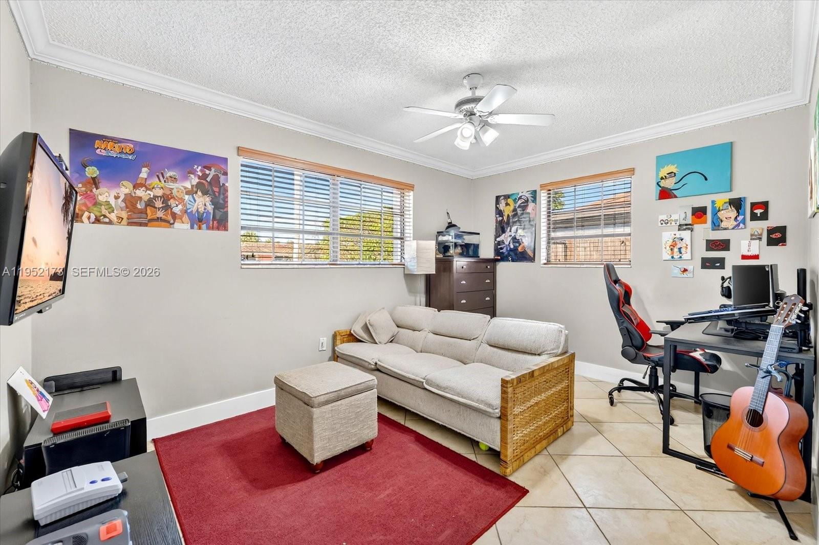 1300 West 77th Street Hialeah, FL 33014 - Photo 23 of 41 a living room with furniture and a flat screen tv