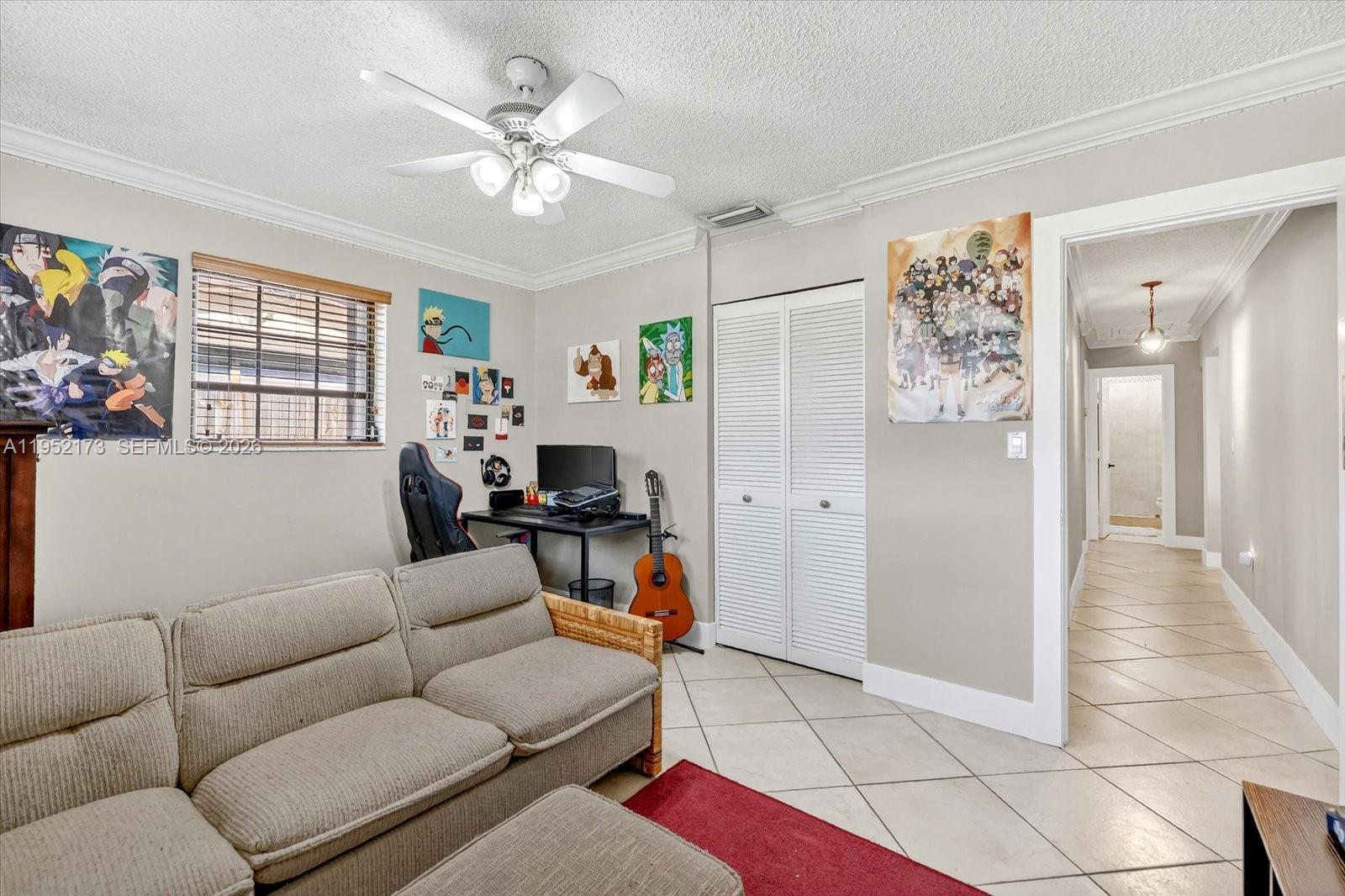 1300 West 77th Street Hialeah, FL 33014 - Photo 24 of 41 a living room with furniture and a window