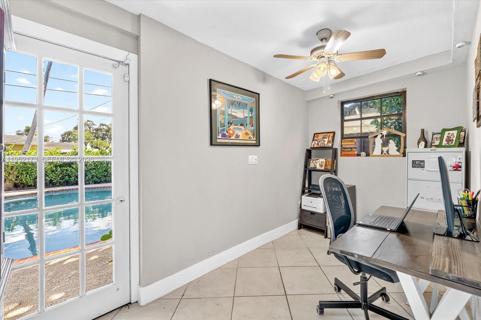 1300 West 77th Street Hialeah, FL 33014 - Photo 25 of 41 a view of a workspace with furniture and a window