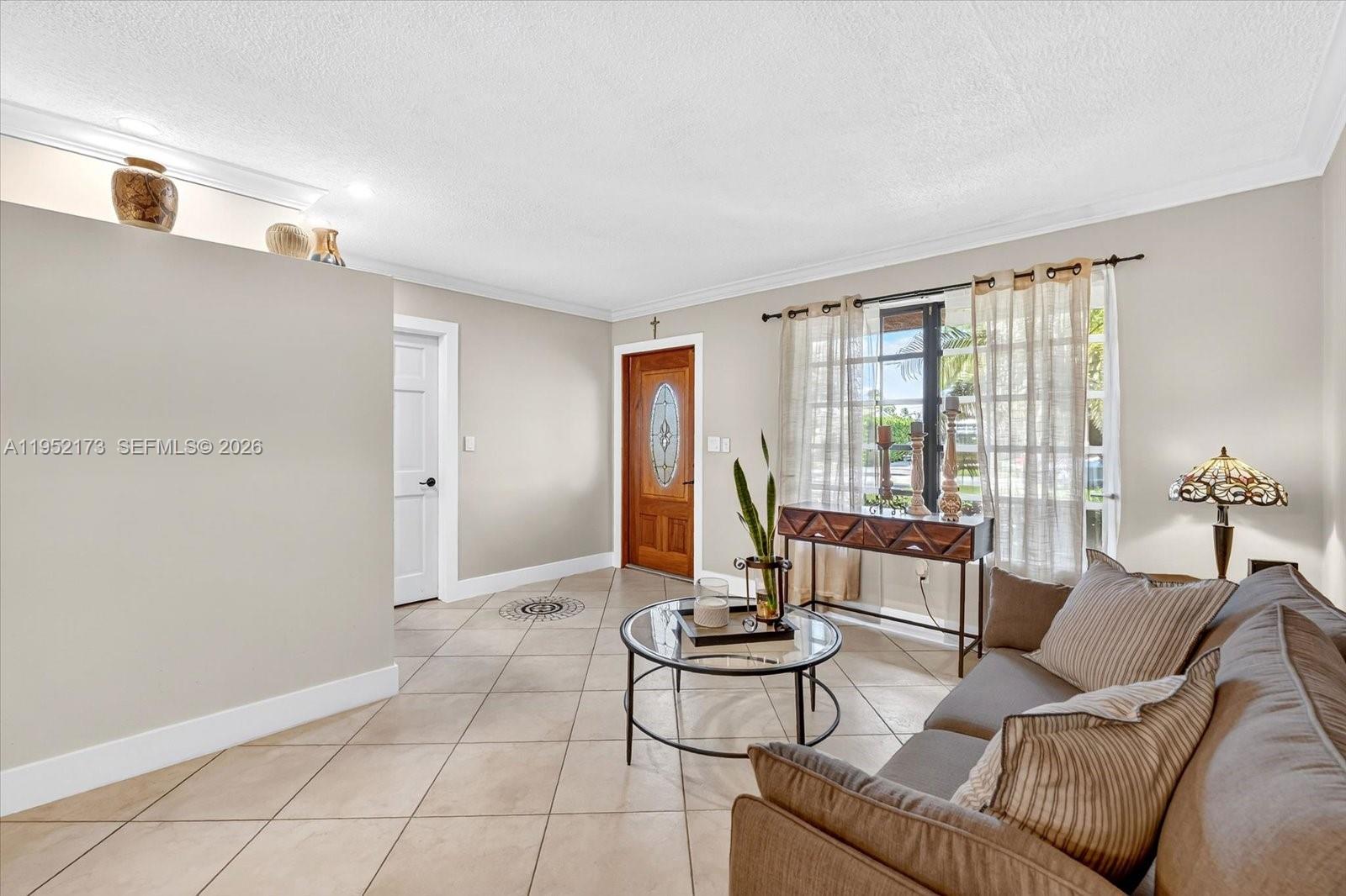 1300 West 77th Street Hialeah, FL 33014 - Photo 5 of 41 a living room with furniture and floor to ceiling windows