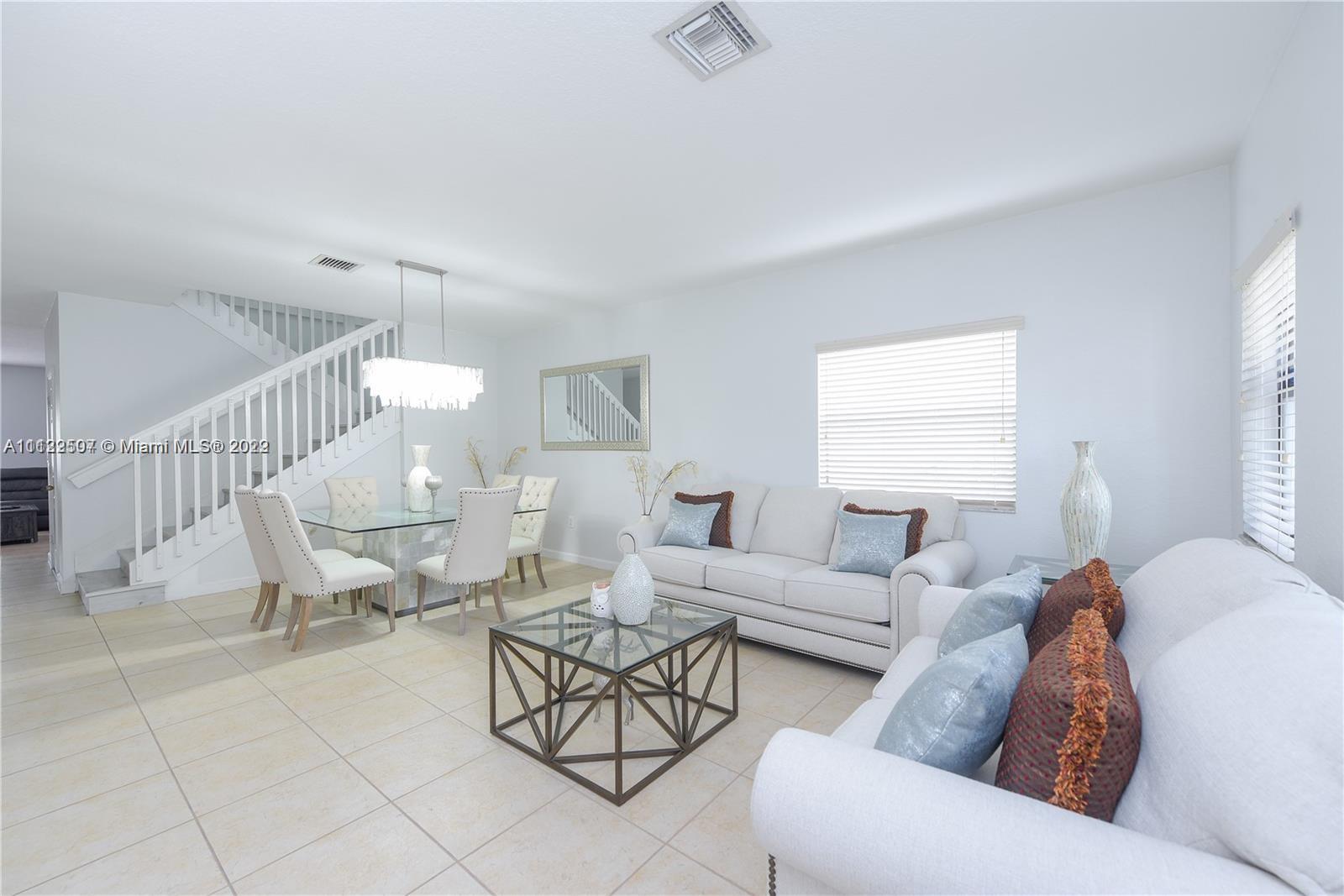 a living room with furniture and a table